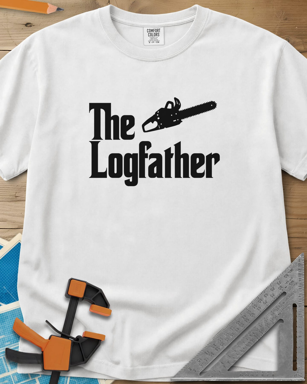 The Logfather heavyweight tee in White, serif lettering with a chainsaw beside the word The