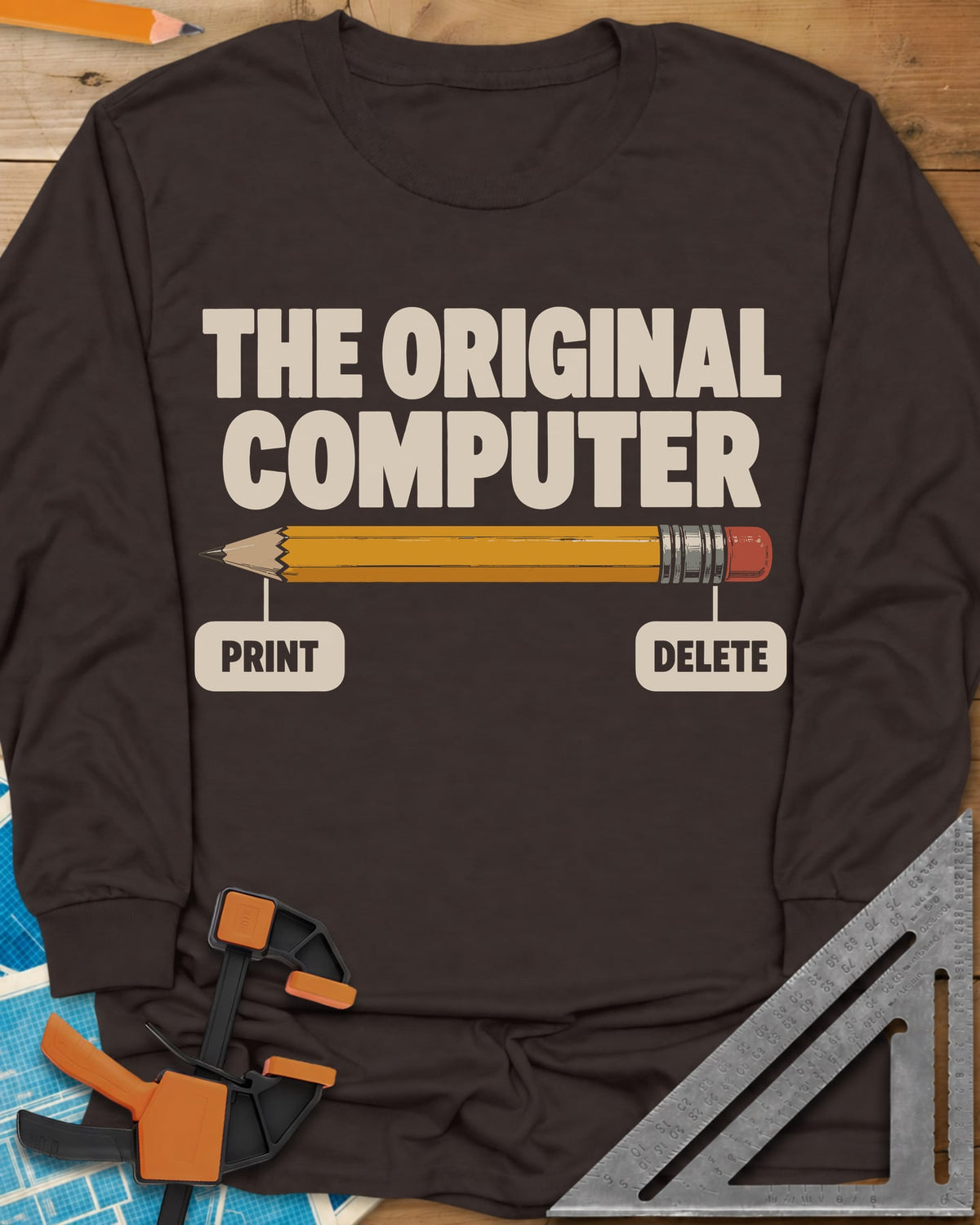 The Original Computer long sleeve shirt in Dark Chocolate, a yellow pencil labeled PRINT at the point and DELETE at the