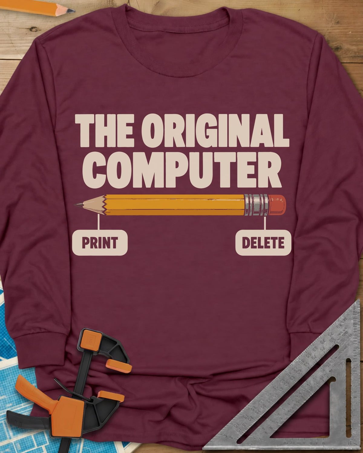 The Original Computer long sleeve shirt in Maroon, a yellow pencil labeled PRINT at the point and DELETE at the eraser
