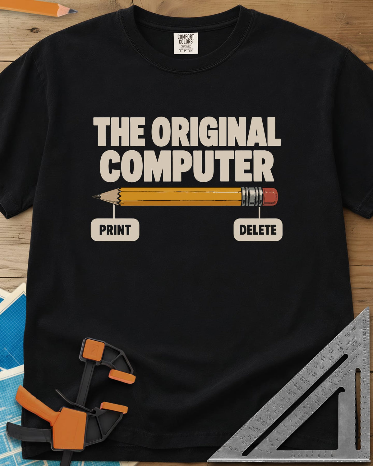 The Original Computer heavyweight tee in Black, a yellow pencil labeled PRINT at the point and DELETE at the eraser