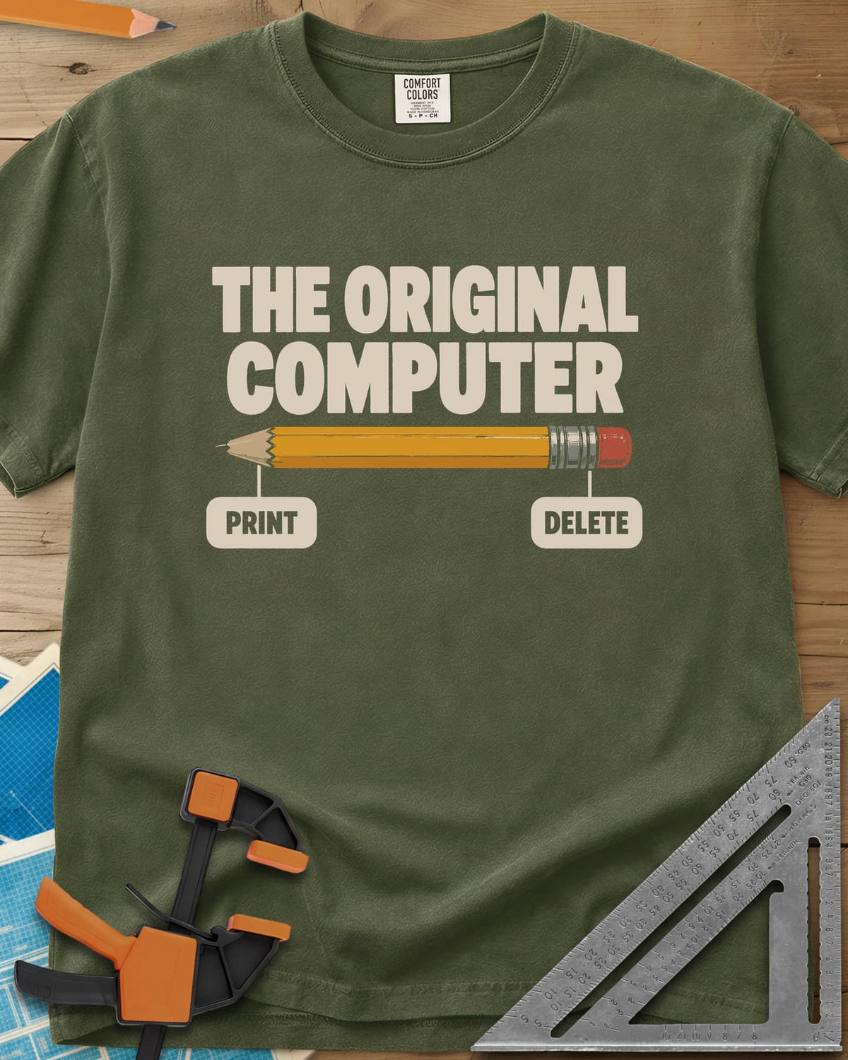 The Original Computer heavyweight tee in Hemp, a yellow pencil labeled PRINT at the point and DELETE at the eraser
