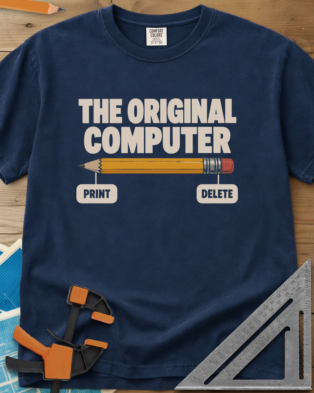 The Original Computer heavyweight tee in Navy, a yellow pencil labeled PRINT at the point and DELETE at the eraser