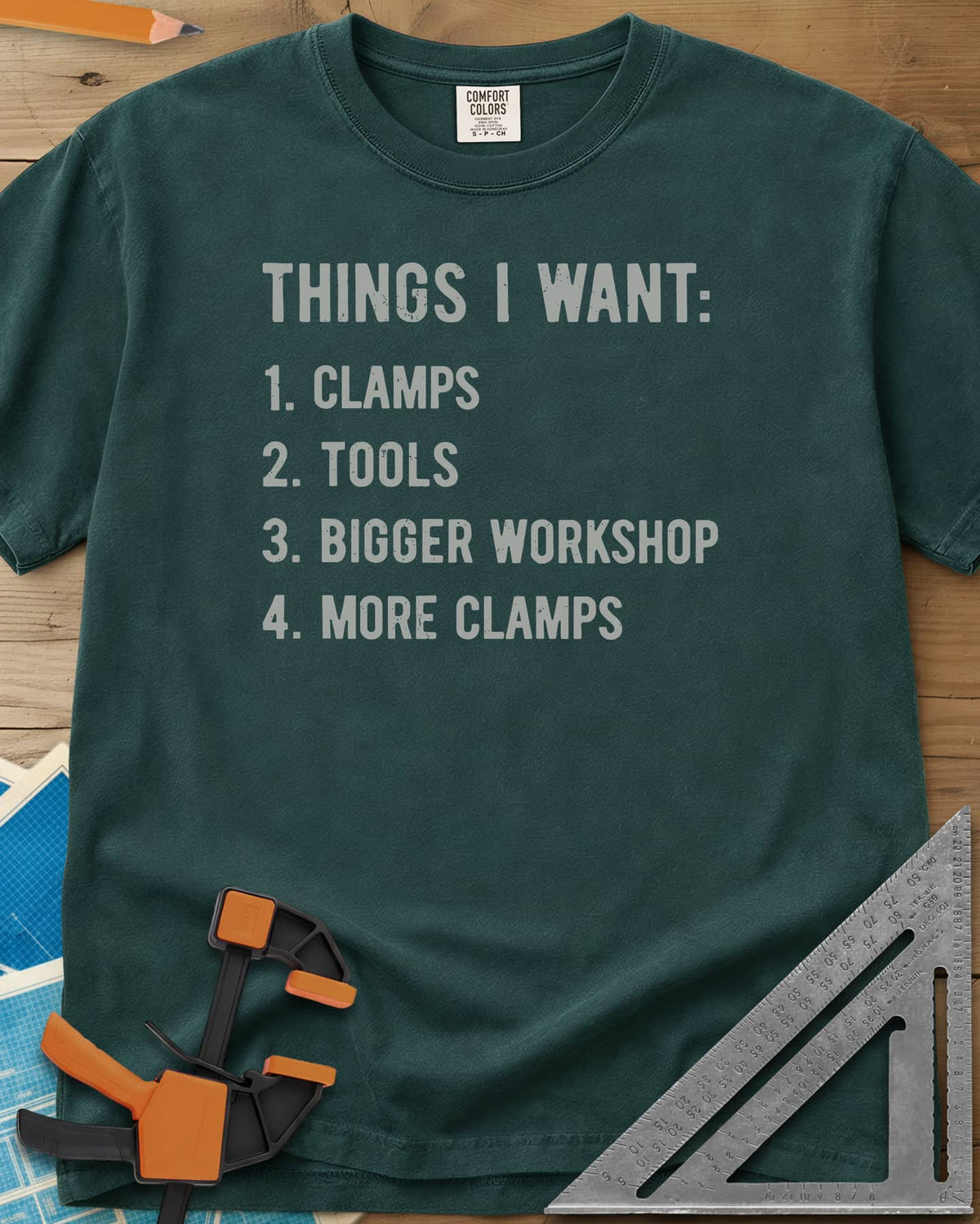 Things I Want Clamps heavyweight tee in Blue Spruce, a plain numbered wish list in worn capitals