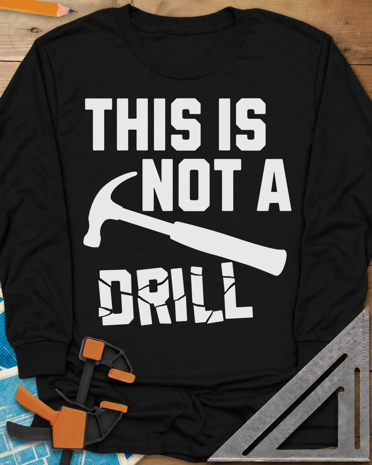 This is Not a Drill long sleeve shirt in Black, a claw hammer across the lettering, with DRILL cracked apart