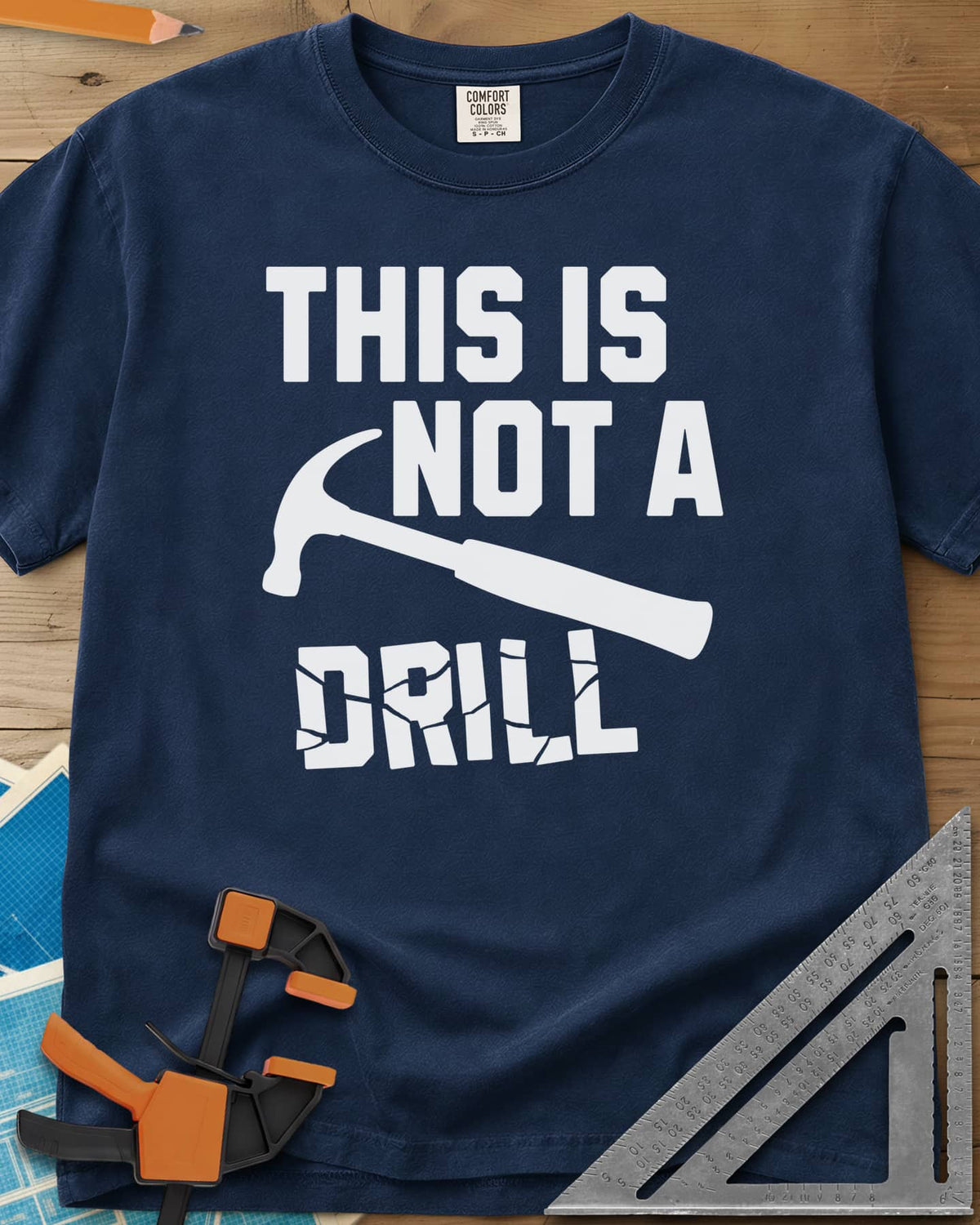 This is Not a Drill heavyweight tee in Navy, a claw hammer across the lettering, with DRILL cracked apart