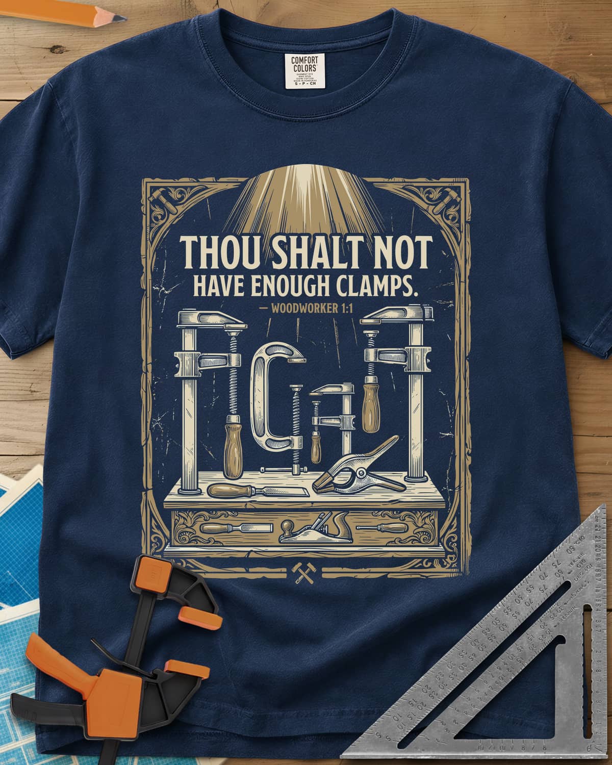 Thou Shalt Have Clamps heavyweight tee in Navy, framed verse over a bench of clamps, a chisel and a hand plane