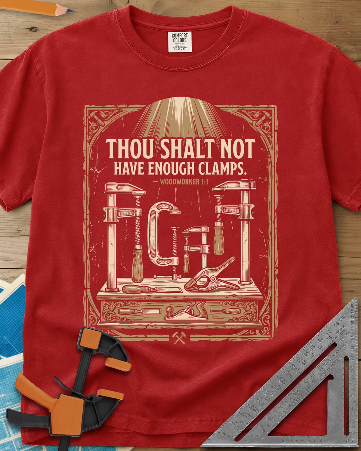 Thou Shalt Have Clamps heavyweight tee in Red, framed verse over a bench of clamps, a chisel and a hand plane