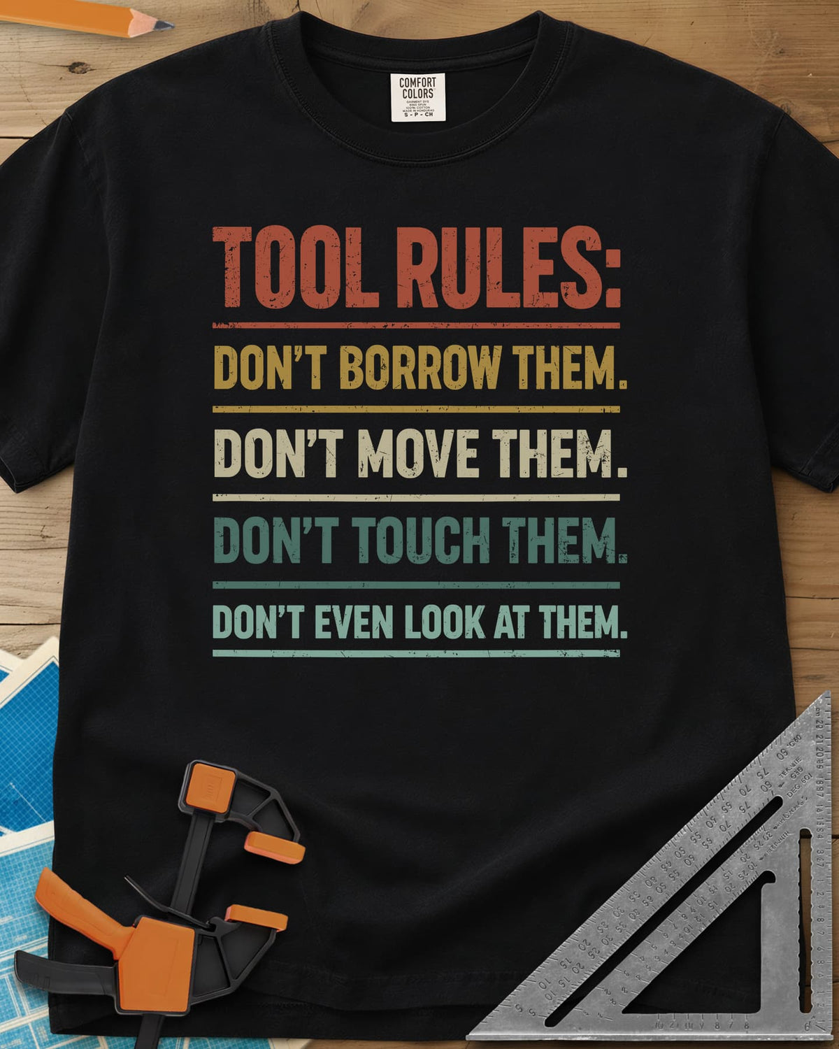 Tool Rules heavyweight tee in Black, stacked rule lines in rust, mustard, cream and teal with thin dividers