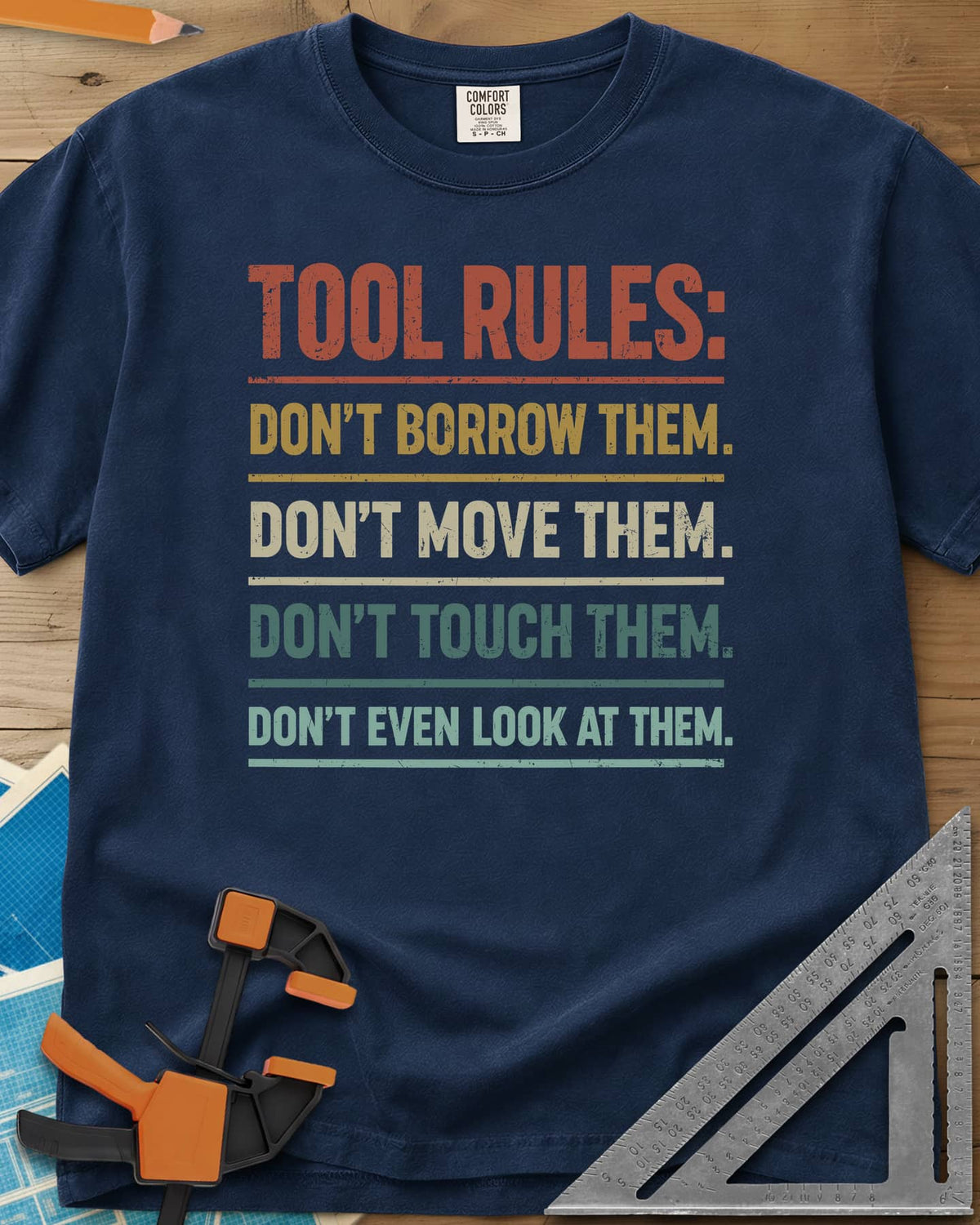 Tool Rules heavyweight tee in Navy, stacked rule lines in rust, mustard, cream and teal with thin dividers