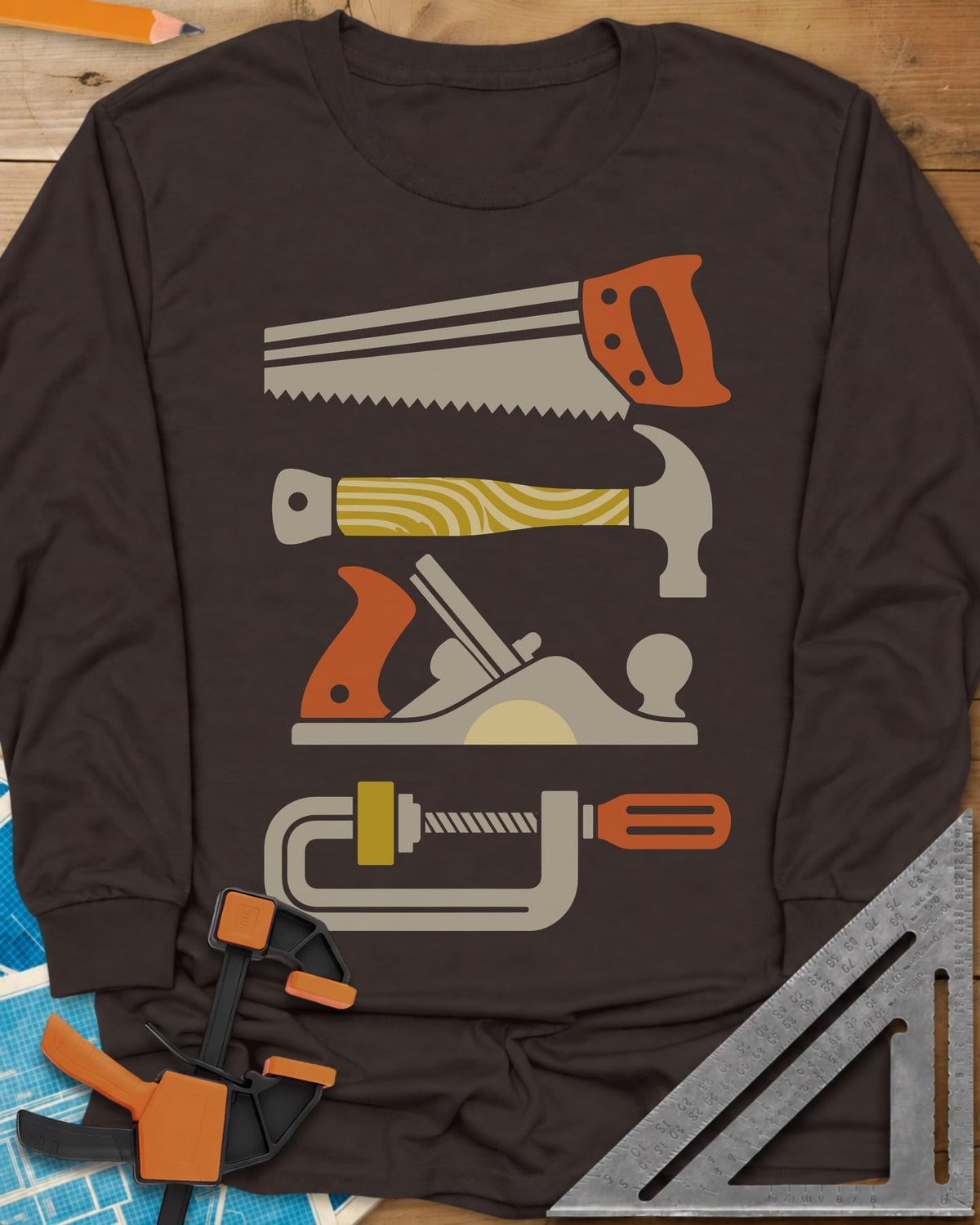 Tools Of The Trade long sleeve shirt in Dark Chocolate, stacked retro flat-color saw, hammer, hand plane and C-clamp