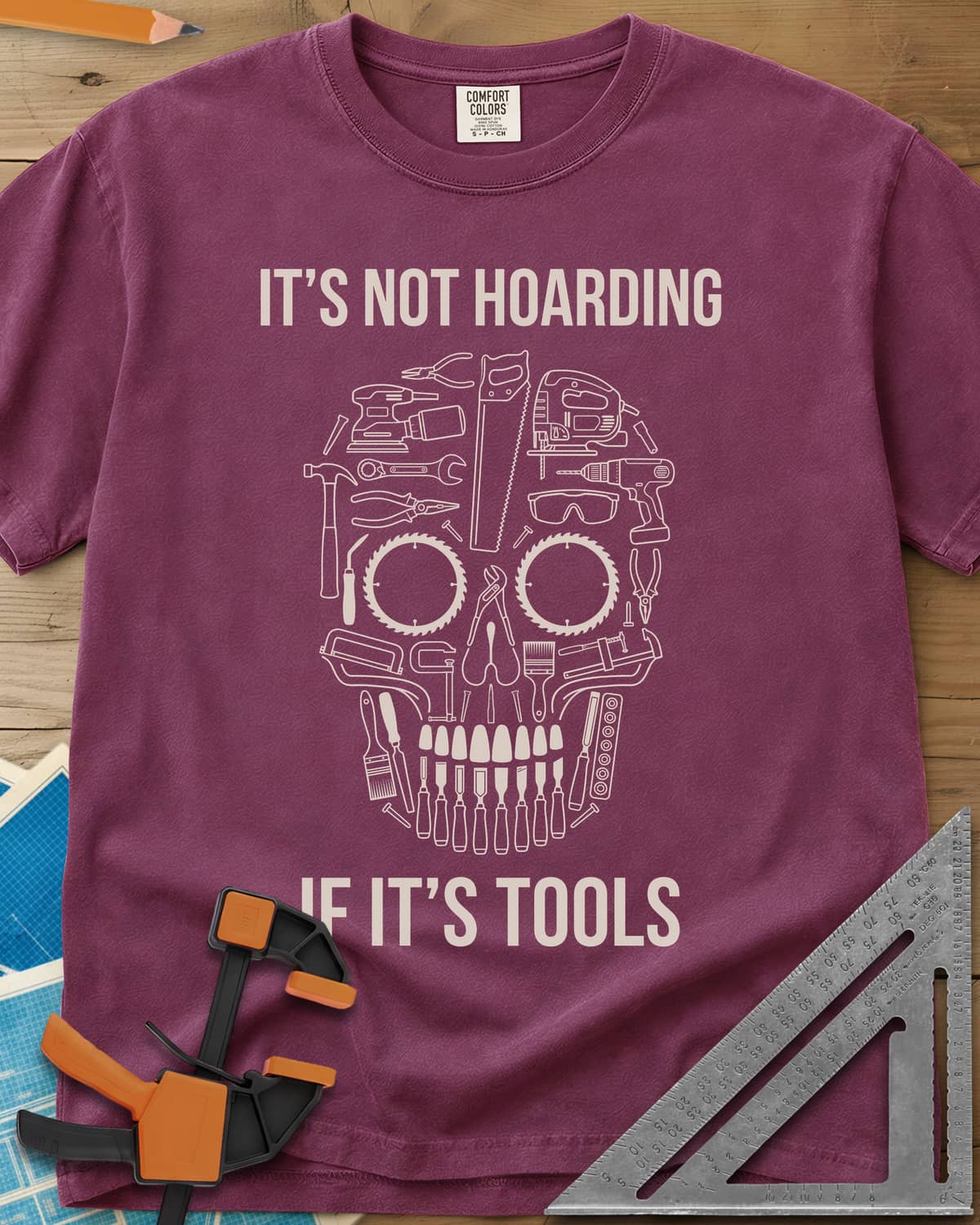 Tools Skull heavyweight tee in Berry, a skull built from outlined tools, saw blades for eyes