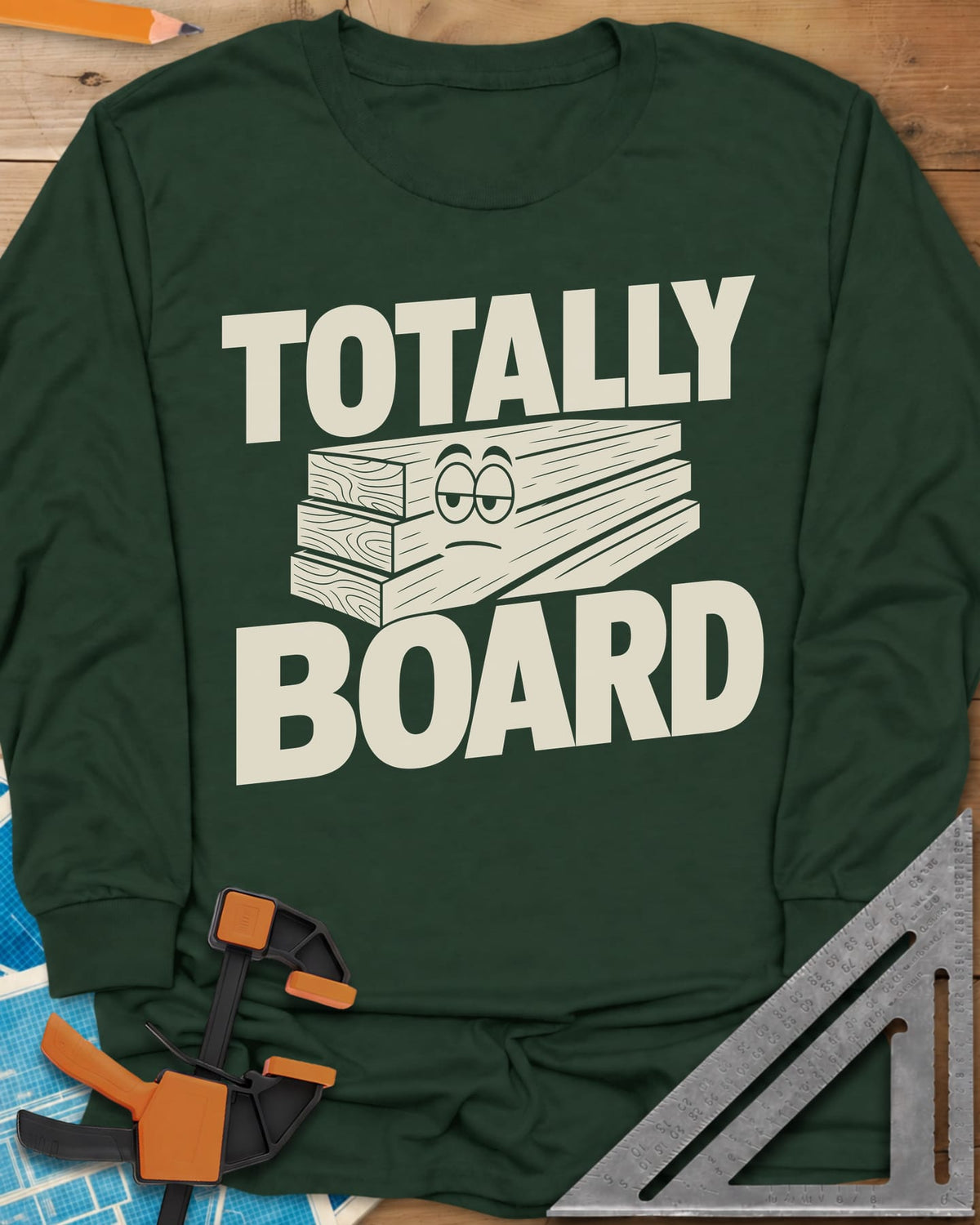Totally Board long sleeve shirt in Forest Green, a stack of three planks wearing a bored, half-lidded face