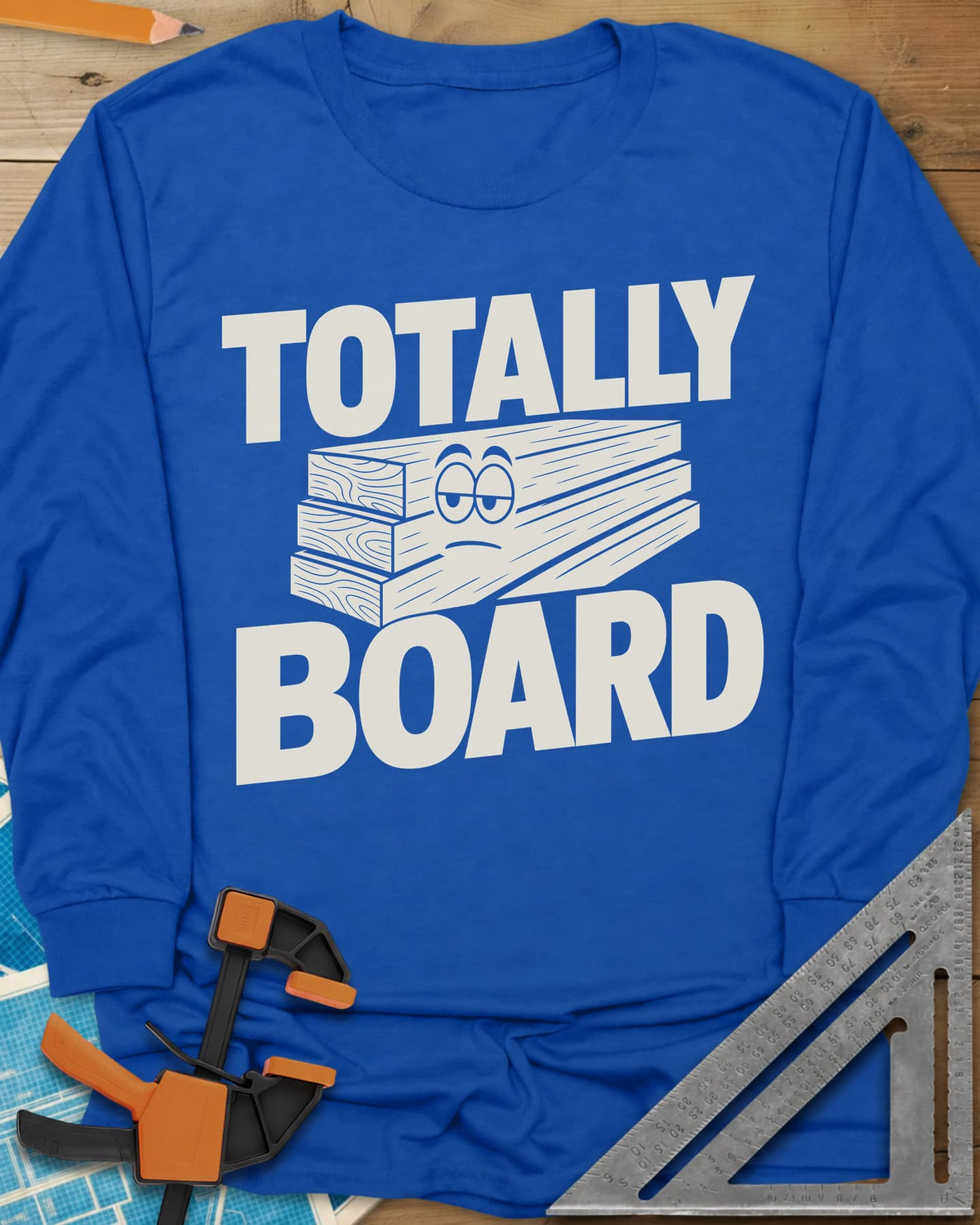 Totally Board long sleeve shirt in Royal, a stack of three planks wearing a bored, half-lidded face