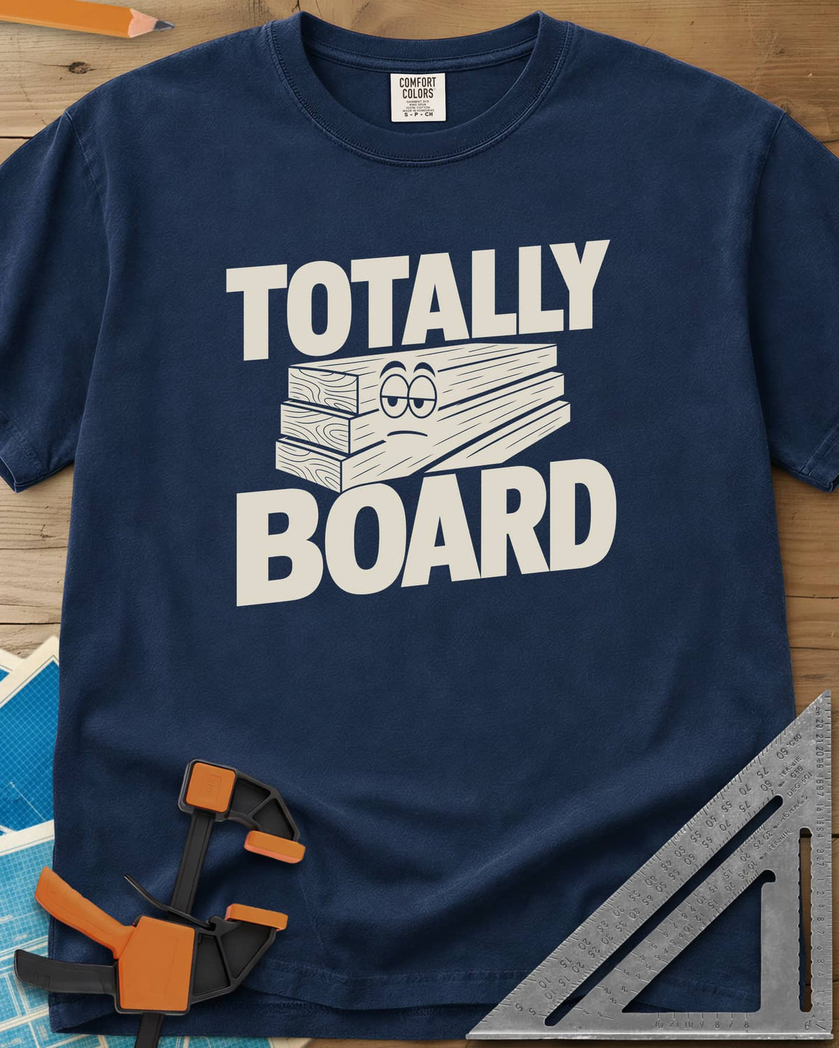 Totally Board heavyweight tee in Navy, a stack of three planks wearing a bored, half-lidded face