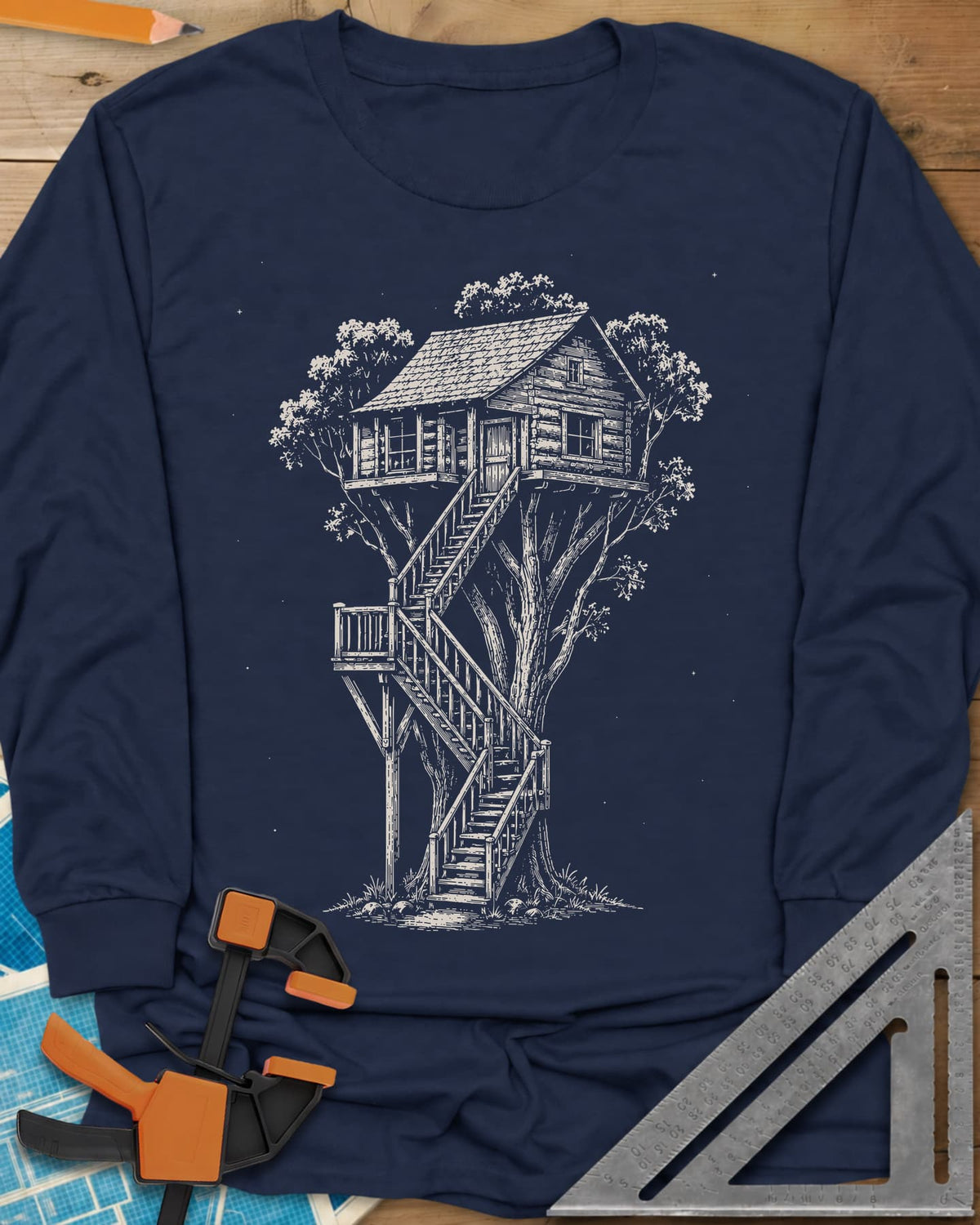 Treehouse Dream Build long sleeve shirt in Navy, ink-style log cabin treehouse with a zigzag staircase