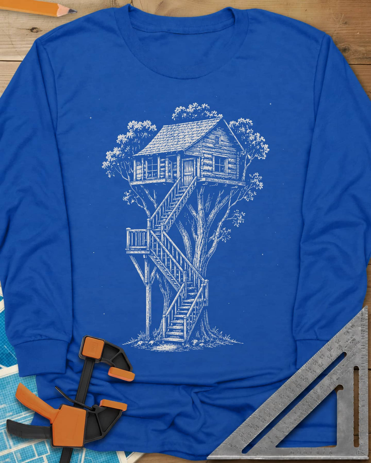 Treehouse Dream Build long sleeve shirt in Royal, ink-style log cabin treehouse with a zigzag staircase