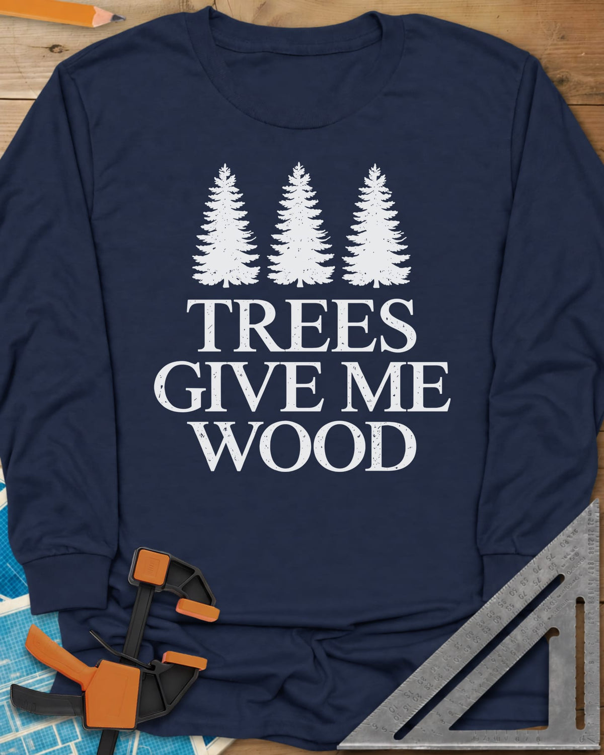 Trees Give Me Wood long sleeve shirt in Navy, three evergreen trees above worn serif lettering