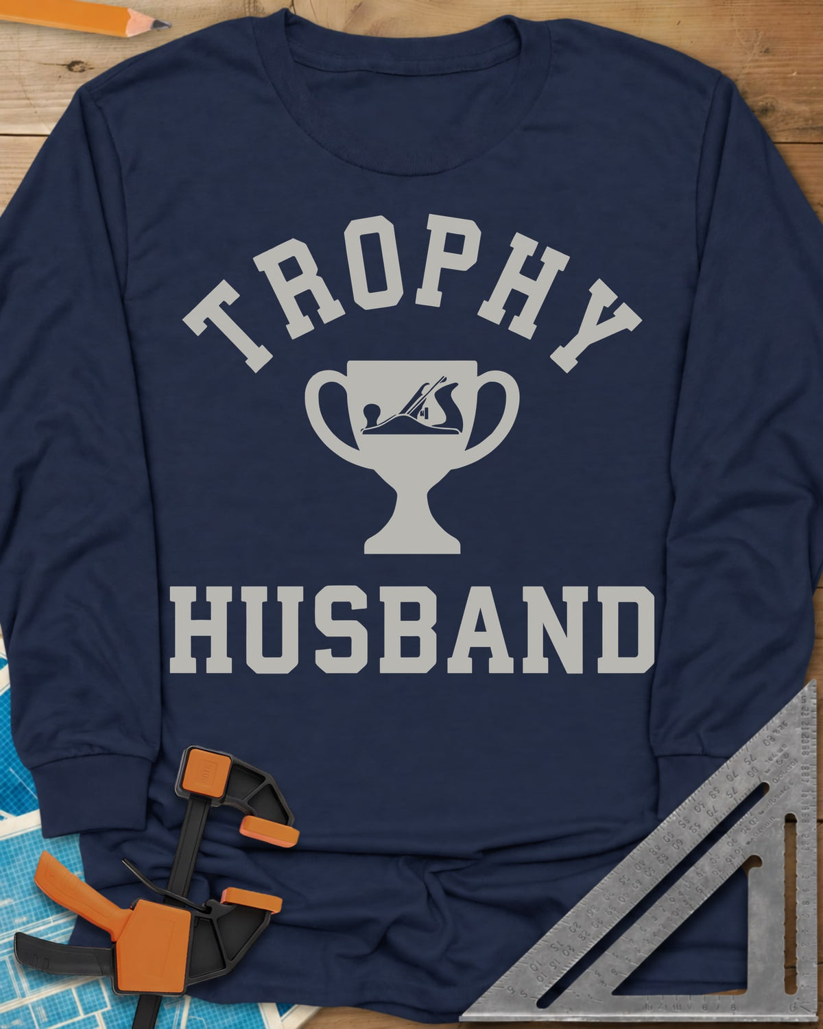 Trophy Husband Woodworker long sleeve shirt in Navy, varsity lettering around a trophy cup with a hand plane on it