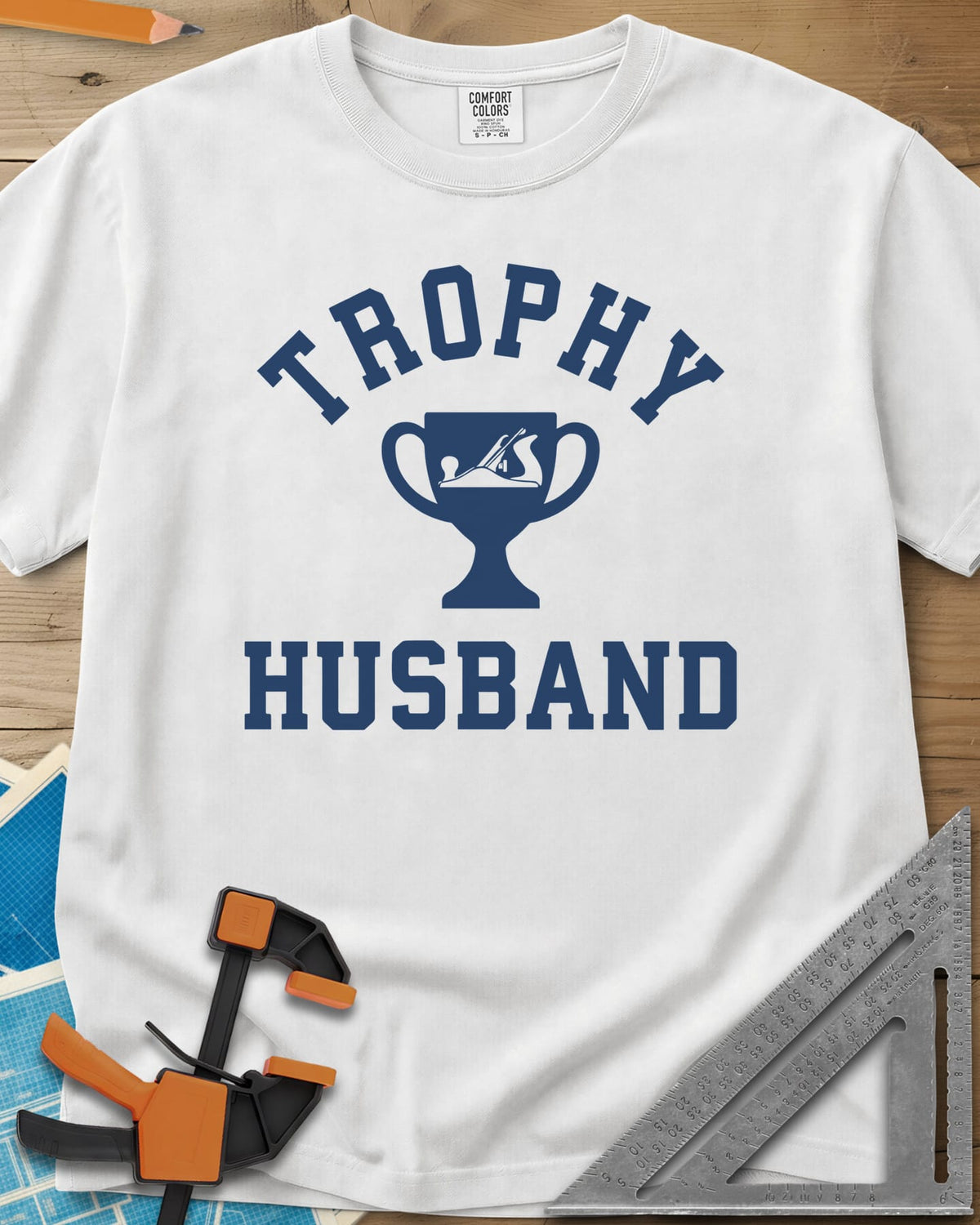Trophy Husband Woodworker heavyweight tee in White, varsity lettering around a trophy cup with a hand plane on it