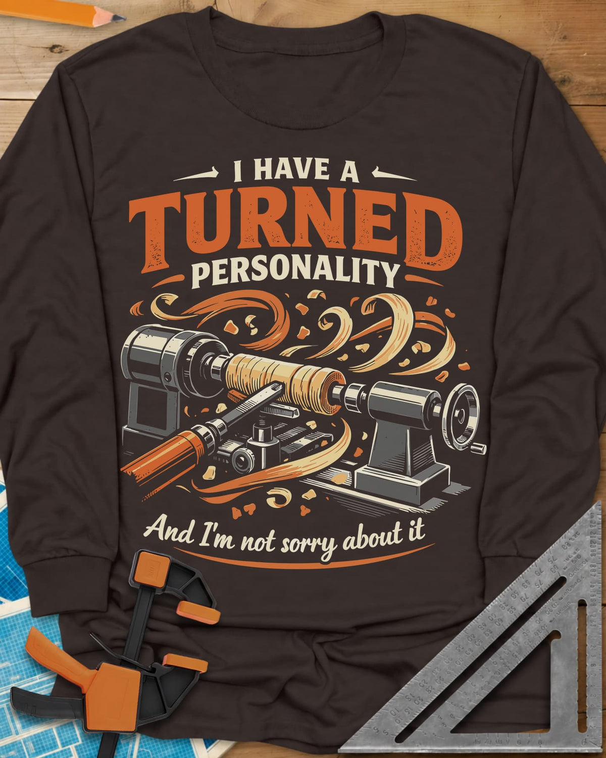 Turned Personality long sleeve shirt in Dark Chocolate, a wood lathe spinning a blank in a spray of orange shavings