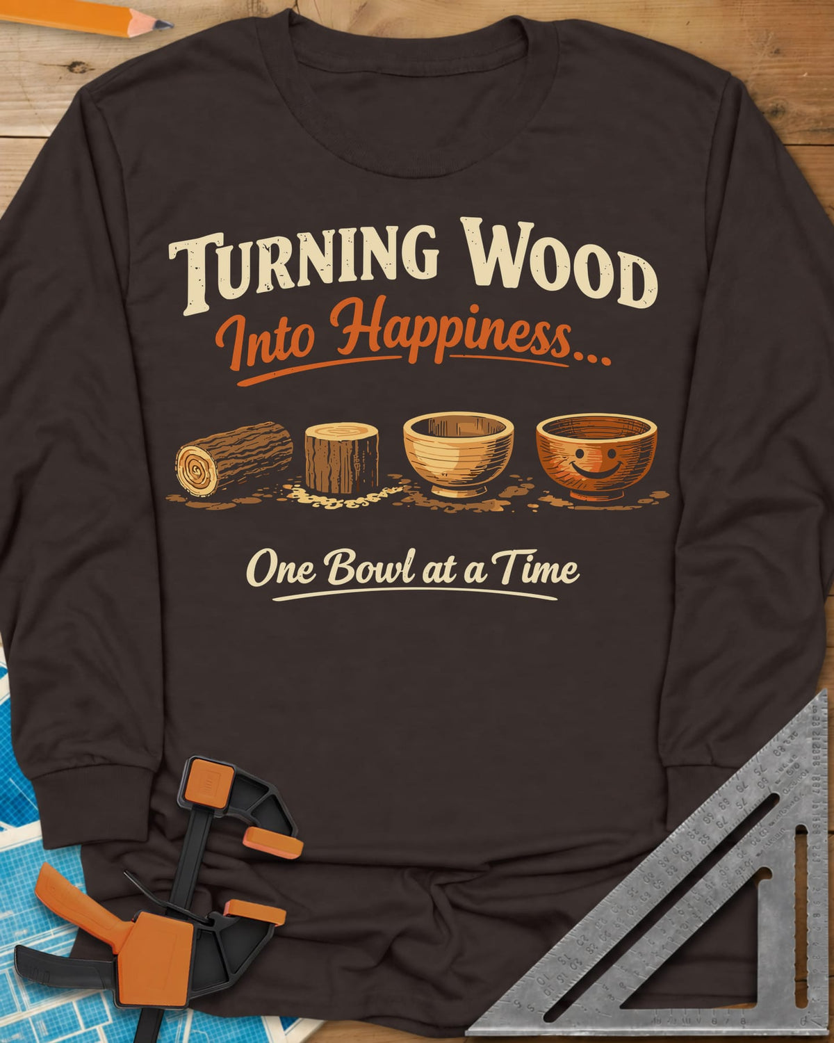 Turning Happiness long sleeve shirt in Dark Chocolate, a log, a stump, a plain bowl and a bowl with a smiley face