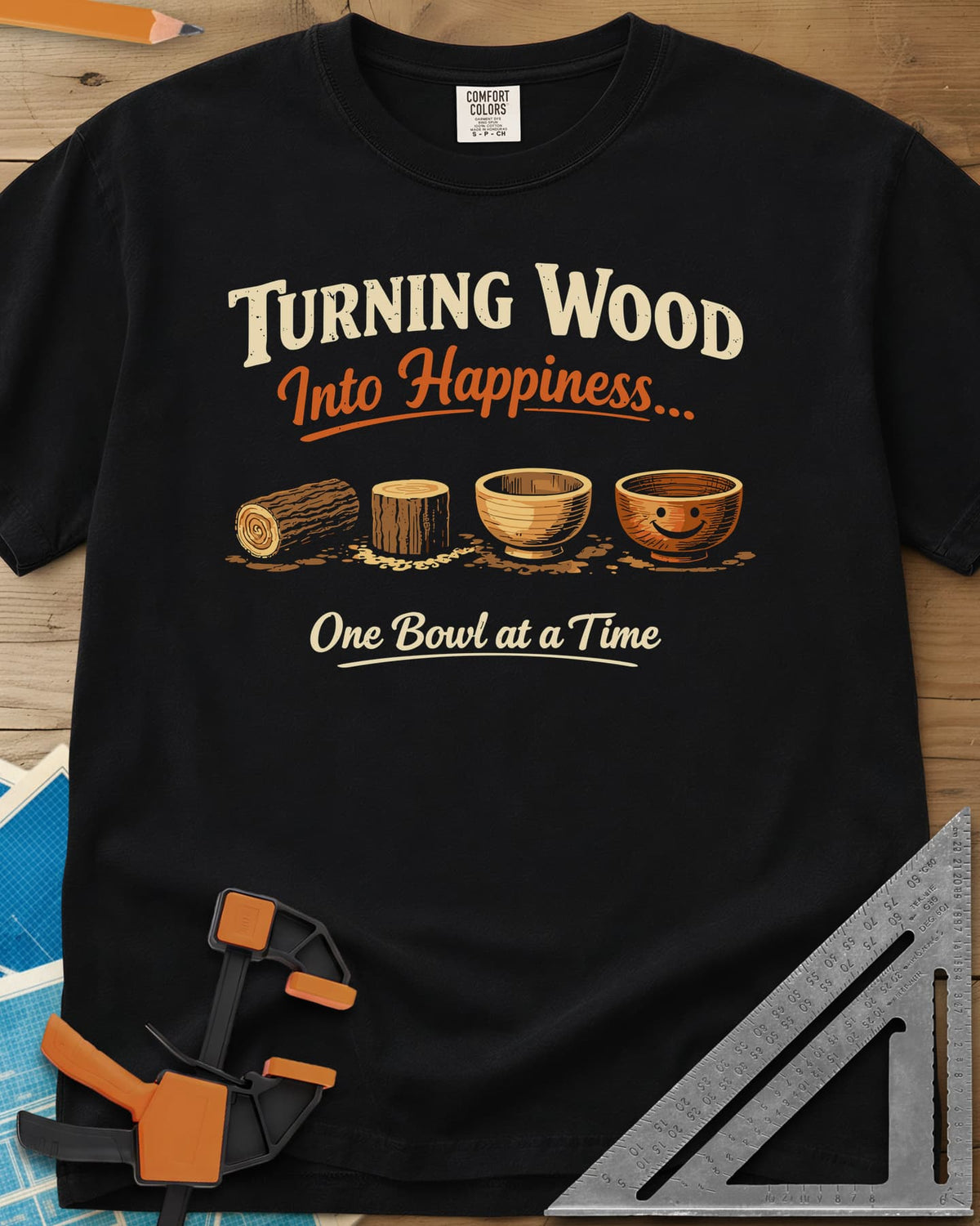Turning Happiness heavyweight tee in Black, a log, a stump, a plain bowl and a bowl with a smiley face