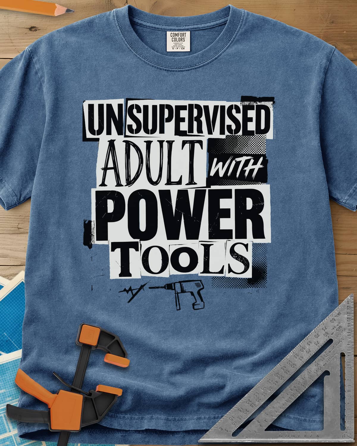 Unsupervised Adult Power Tools Humor heavyweight tee in Blue Jean, cut-paper ransom-note lettering with a small drill