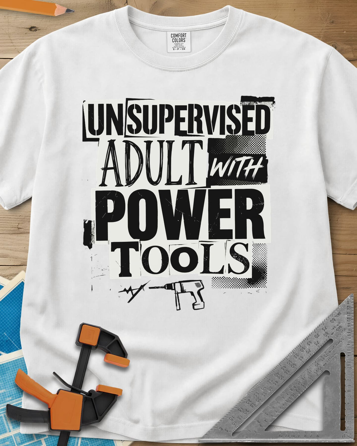 Unsupervised Adult Power Tools Humor heavyweight tee in White, cut-paper ransom-note lettering with a small drill underneath