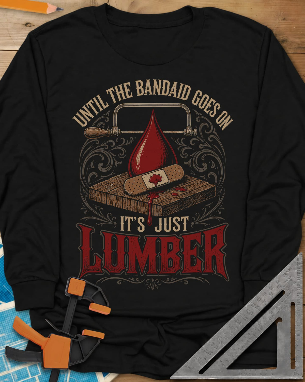 Until The Bandaid Goes On It's Just Lumber long sleeve shirt in Black, frame saw, red drop and a bandaid on a board with