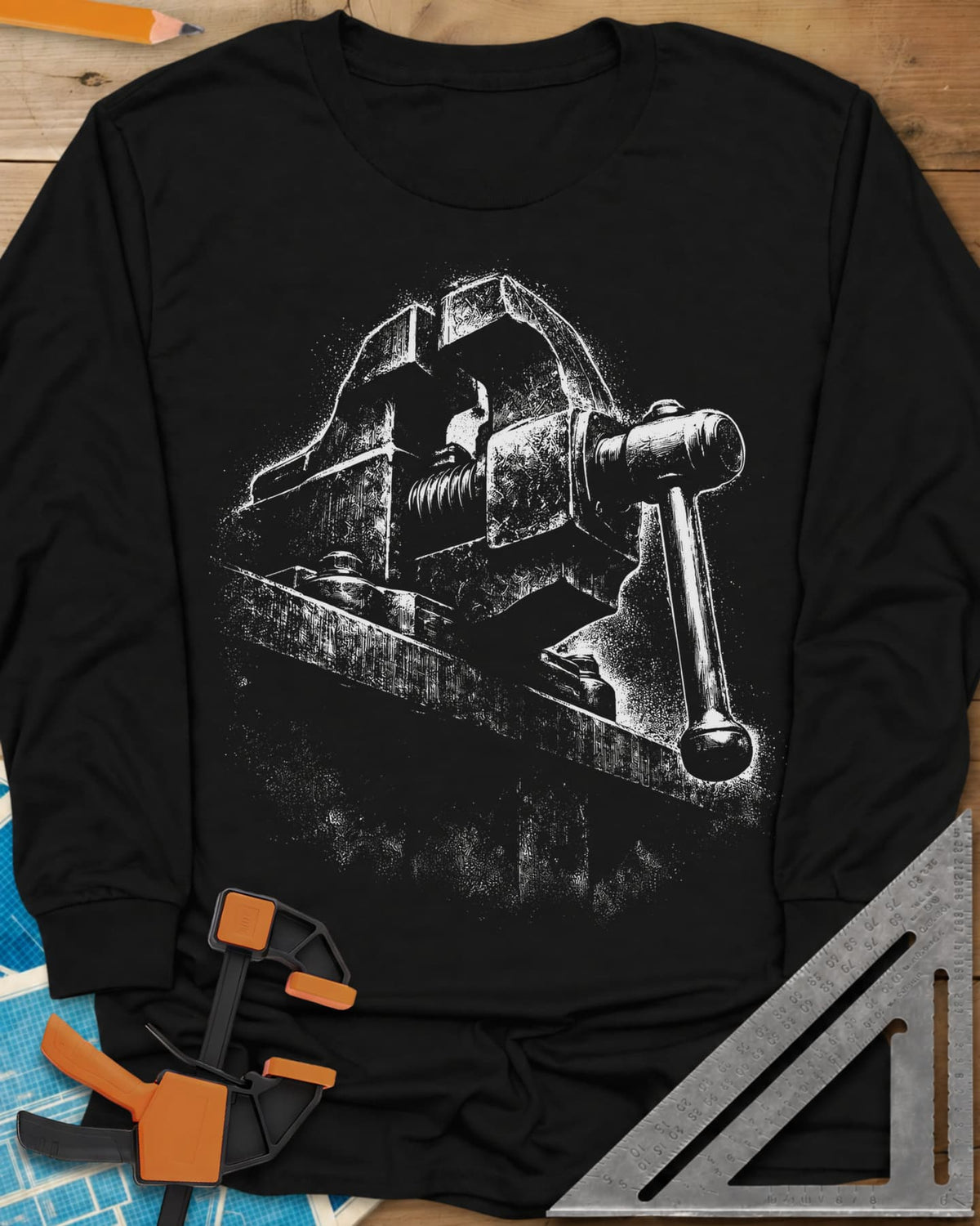 Vintage Bench Vise long sleeve shirt in Black, a worn cast-iron bench vise in gritty chalk-dust texture