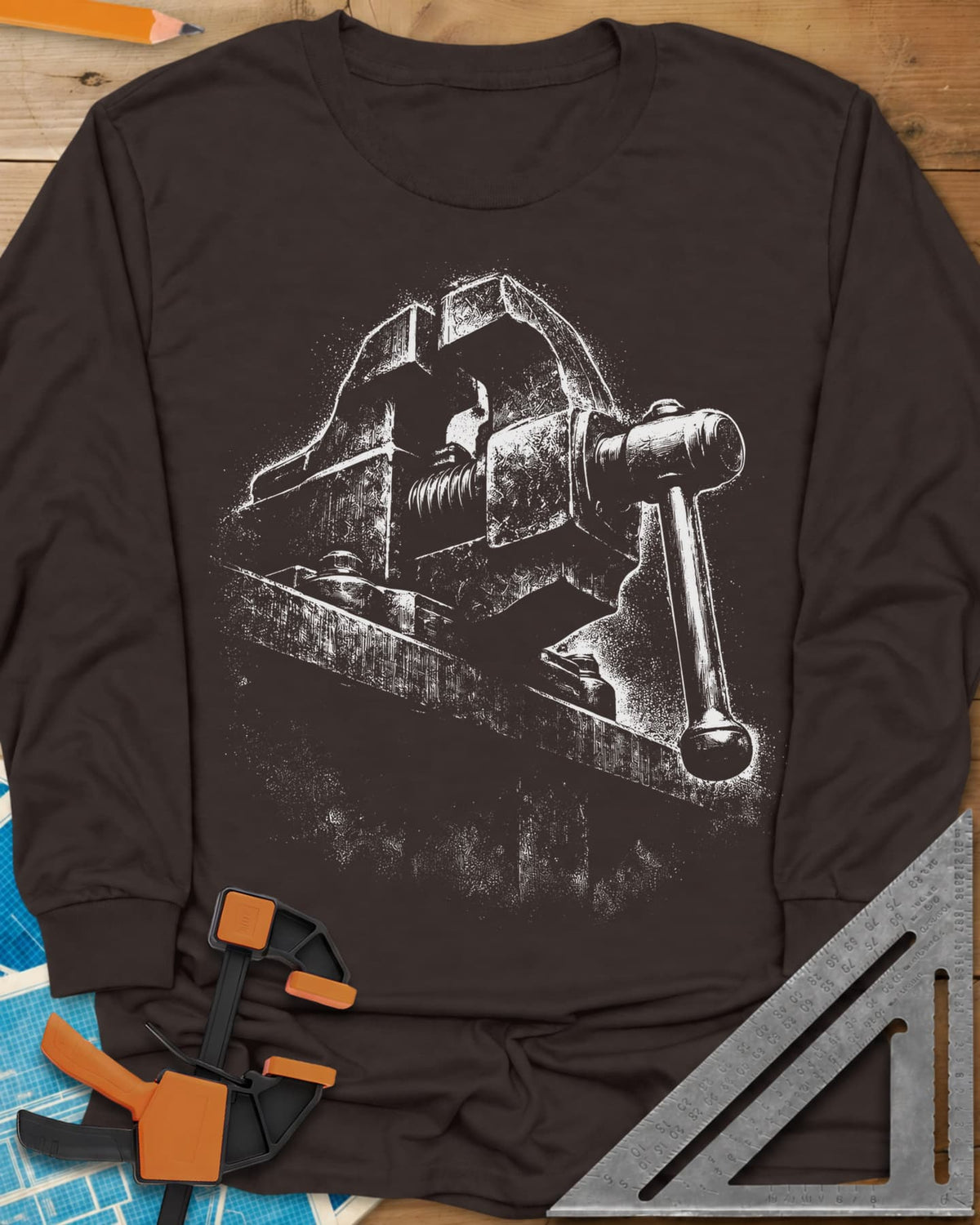 Vintage Bench Vise long sleeve shirt in Dark Chocolate, a worn cast-iron bench vise in gritty chalk-dust texture