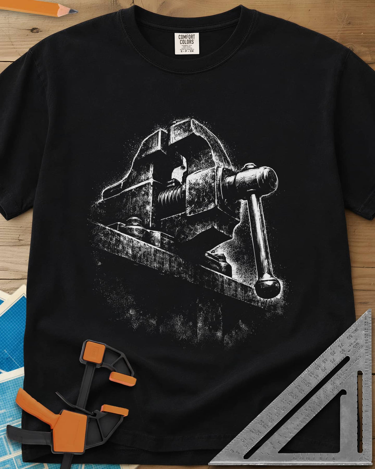 Vintage Bench Vise heavyweight tee in Black, a worn cast-iron bench vise in gritty chalk-dust texture