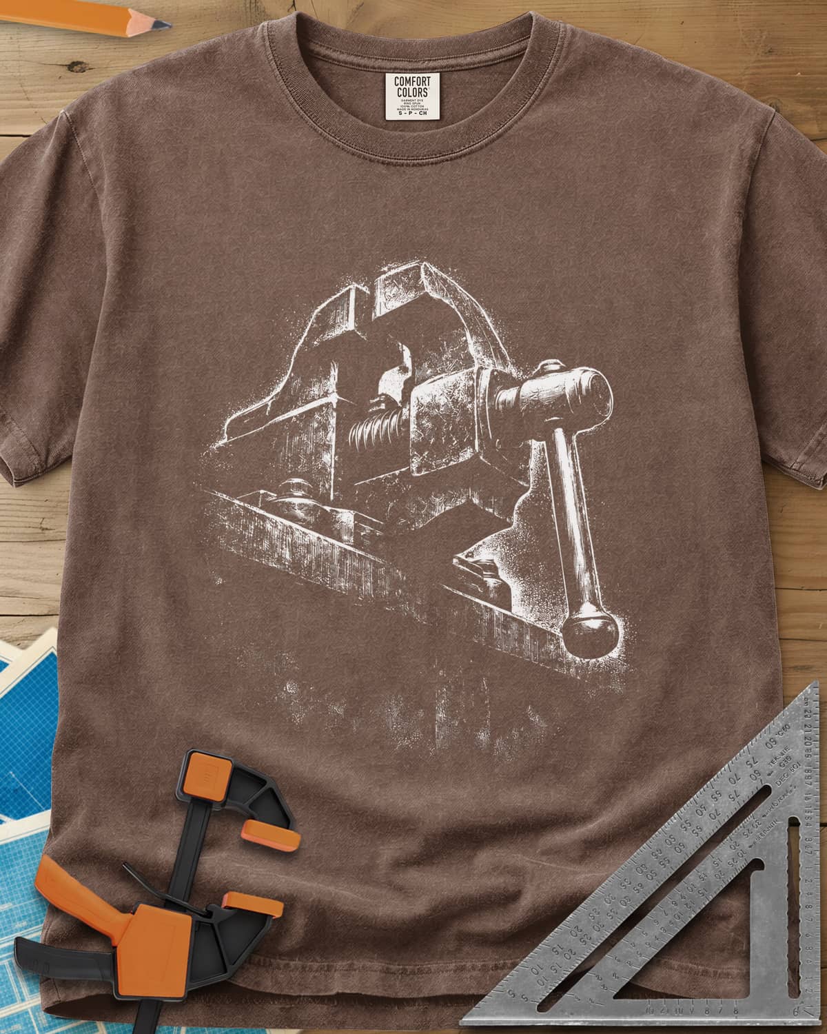 Vintage Bench Vise heavyweight tee in Espresso, a worn cast-iron bench vise in gritty chalk-dust texture