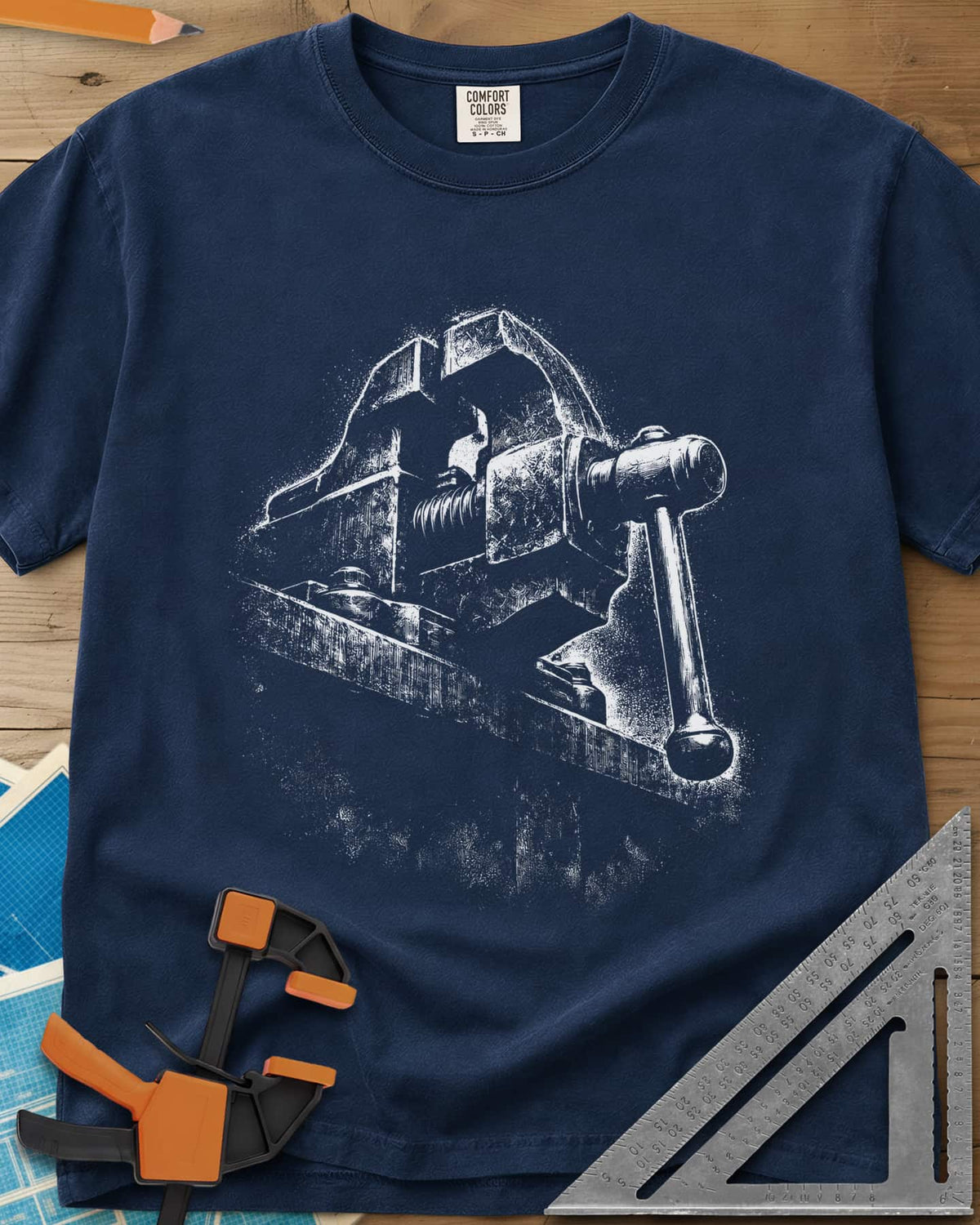 Vintage Bench Vise heavyweight tee in Navy, a worn cast-iron bench vise in gritty chalk-dust texture