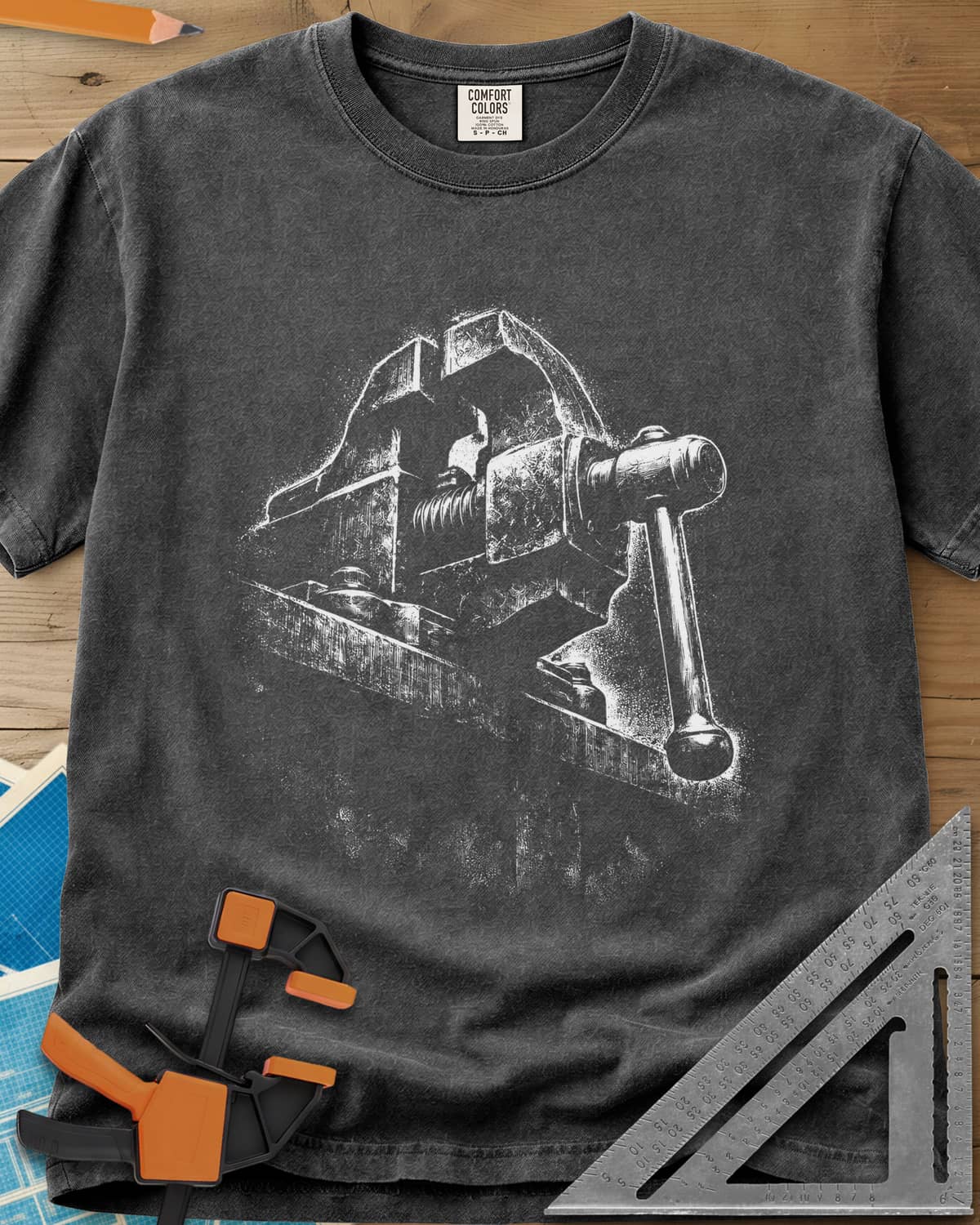 Vintage Bench Vise heavyweight tee in Pepper, a worn cast-iron bench vise in gritty chalk-dust texture