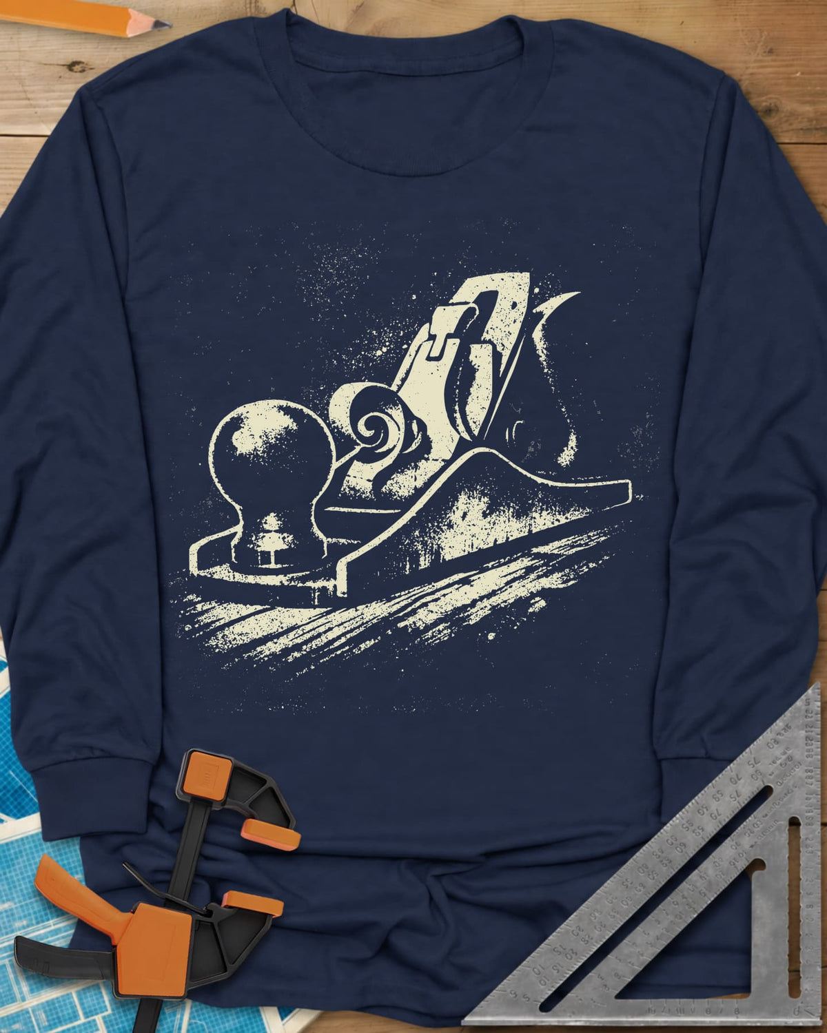 Vintage Hand Plane long sleeve shirt in Navy, a speckled hand plane with a shaving curl on grained wood