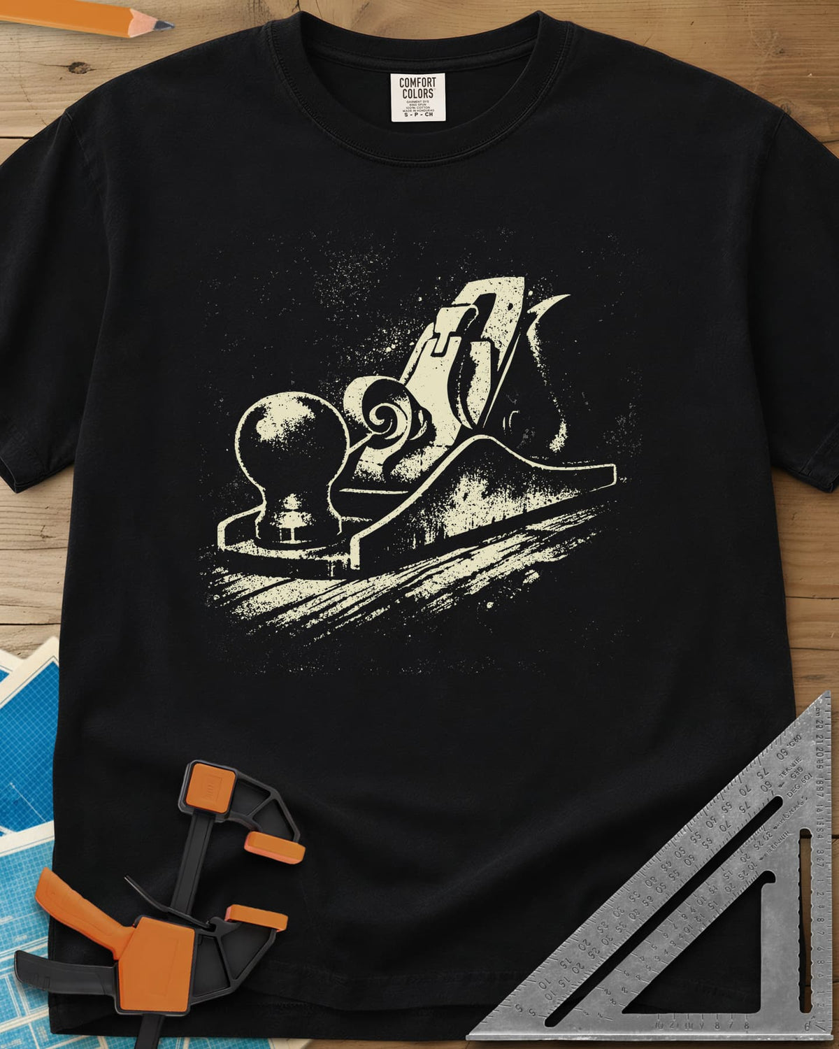 Vintage Hand Plane heavyweight tee in Black, a speckled hand plane with a shaving curl on grained wood