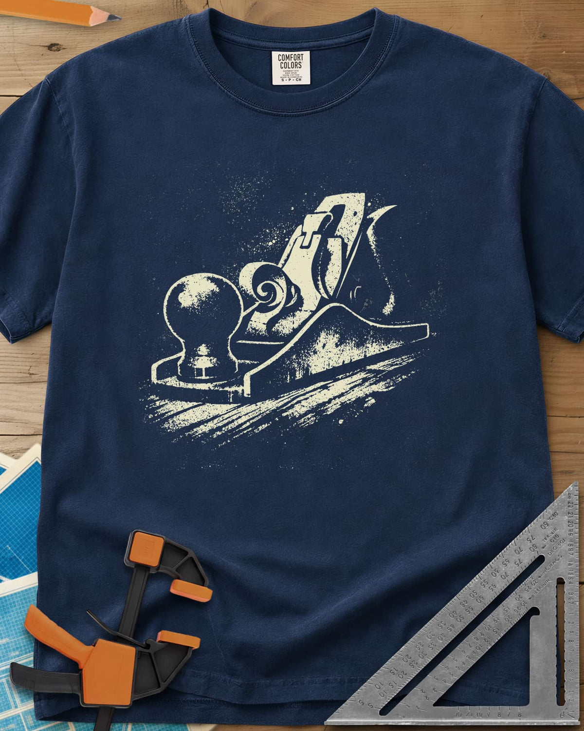 Vintage Hand Plane heavyweight tee in Navy, a speckled hand plane with a shaving curl on grained wood