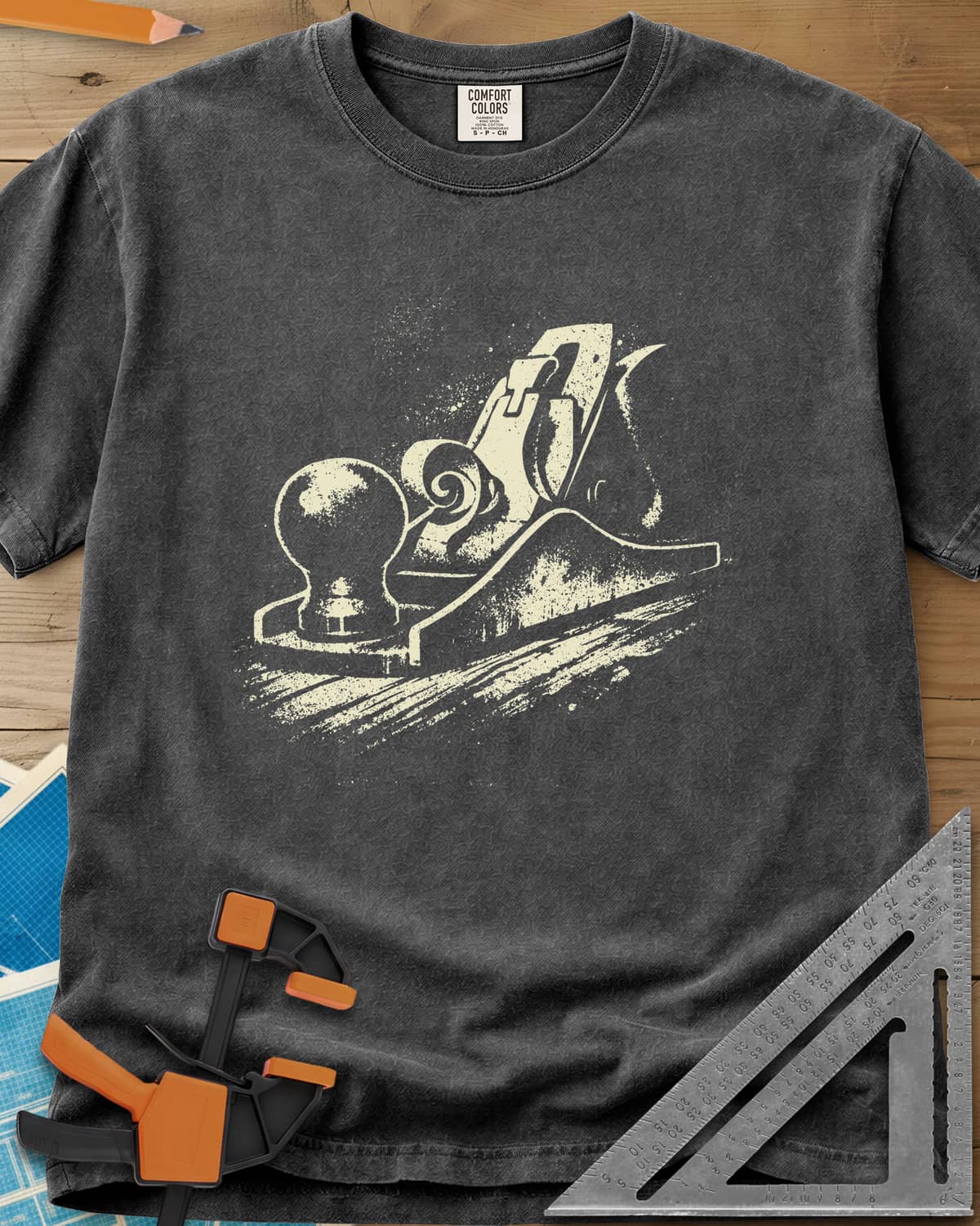 Vintage Hand Plane heavyweight tee in Pepper, a speckled hand plane with a shaving curl on grained wood