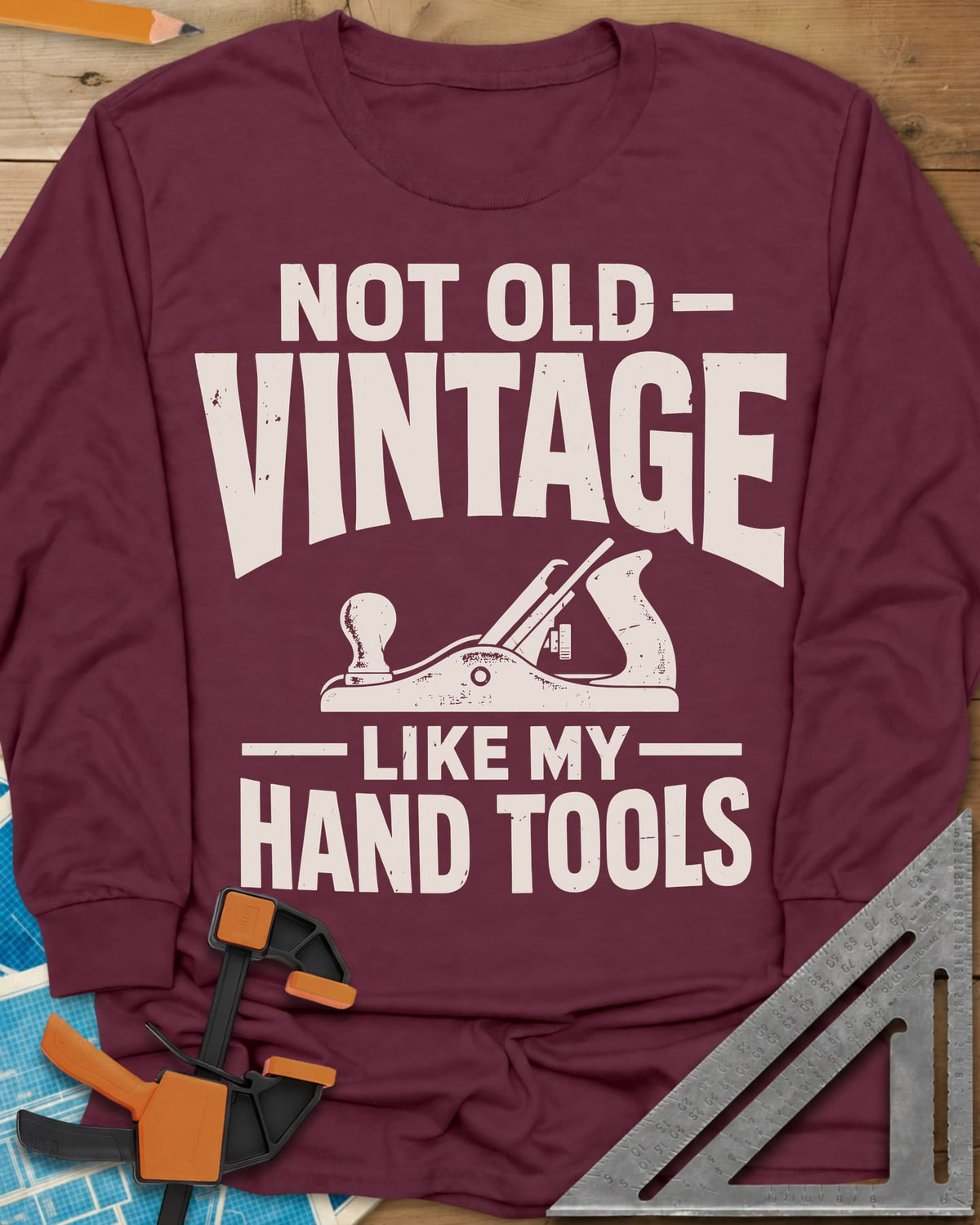 Vintage Tools long sleeve shirt in Maroon, a small bench plane between worn block lettering