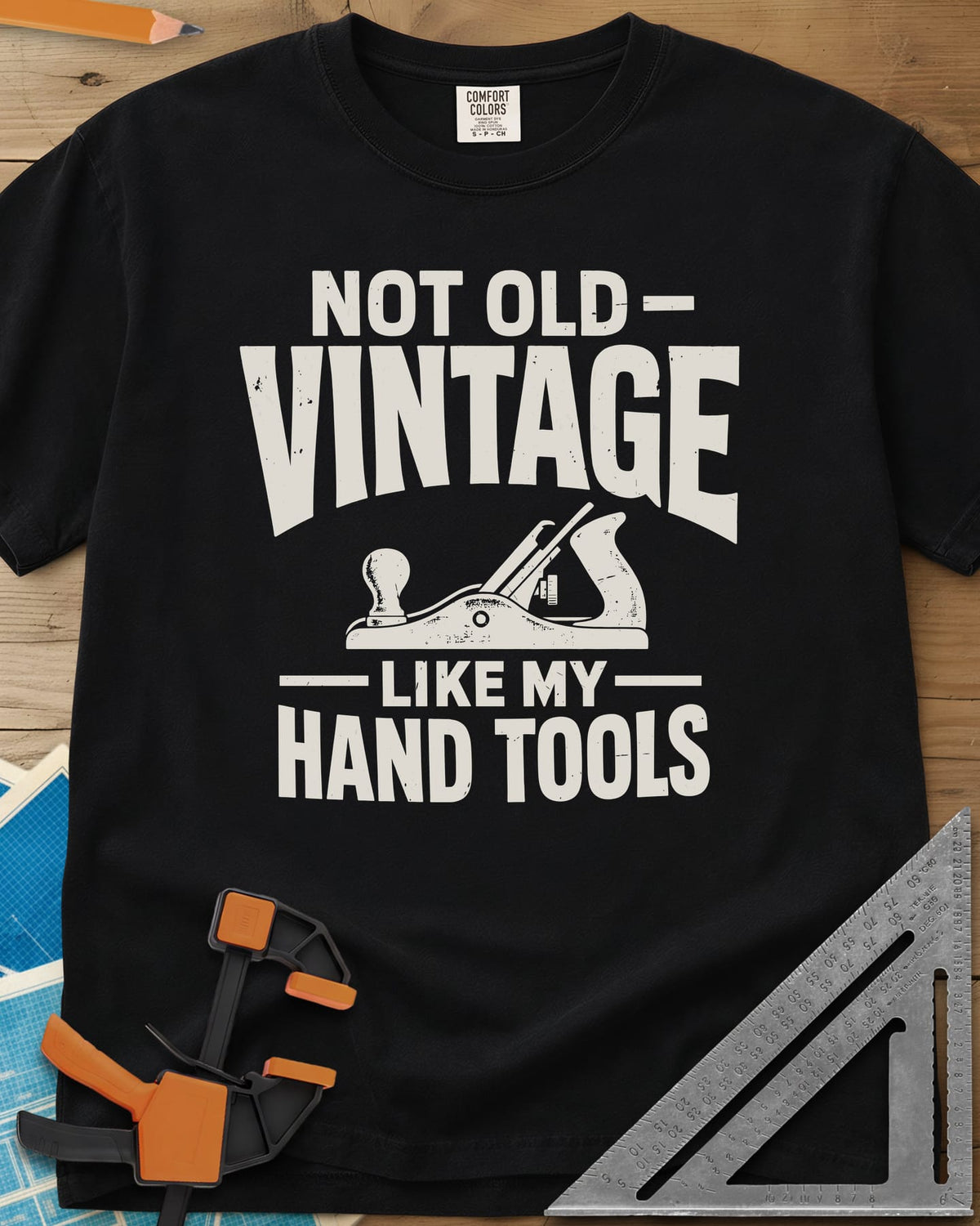 Vintage Tools heavyweight tee in Black, a small bench plane between worn block lettering