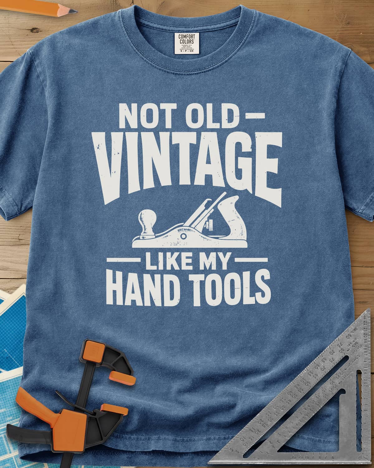 Vintage Tools heavyweight tee in Blue Jean, a small bench plane between worn block lettering