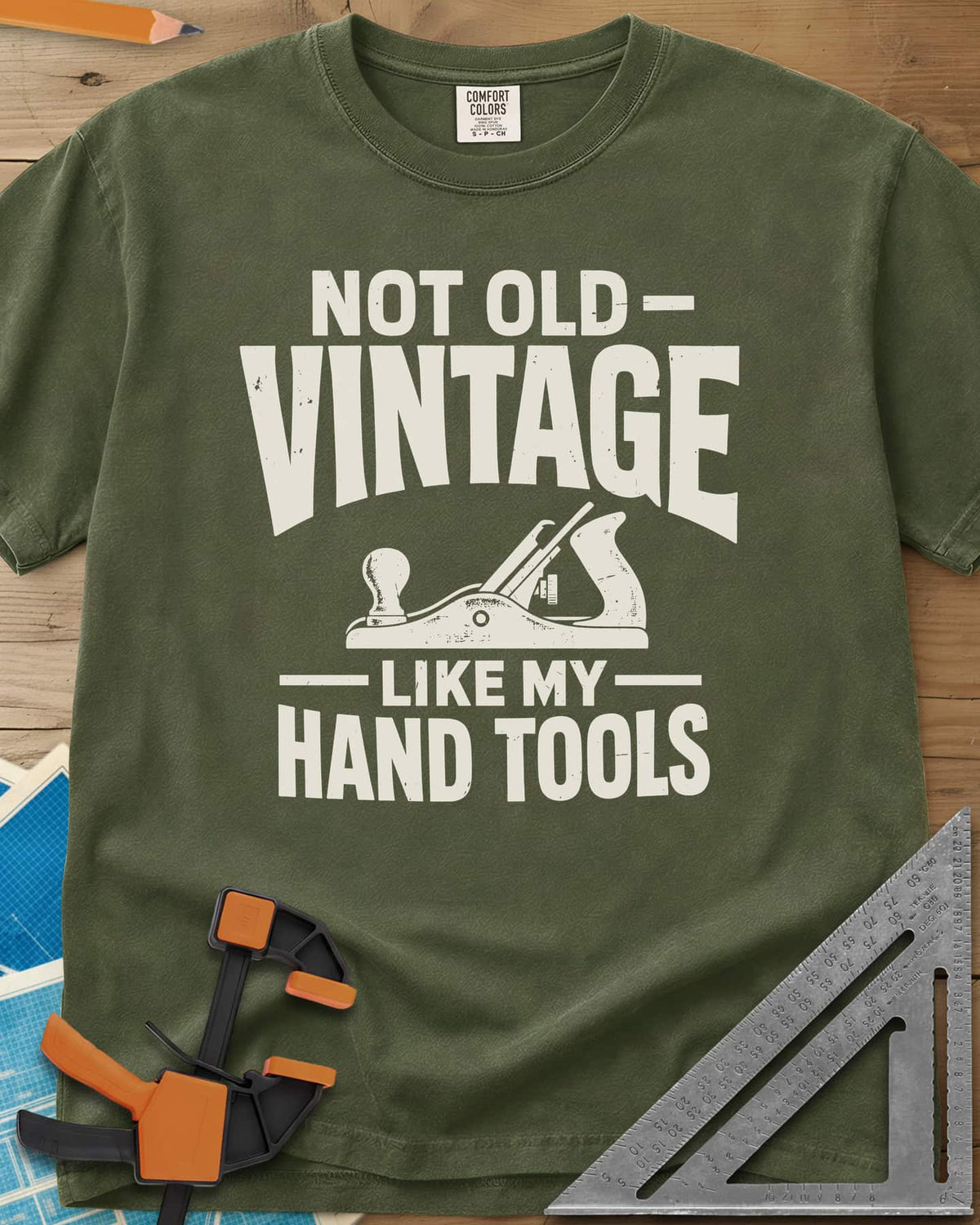 Vintage Tools heavyweight tee in Hemp, a small bench plane between worn block lettering