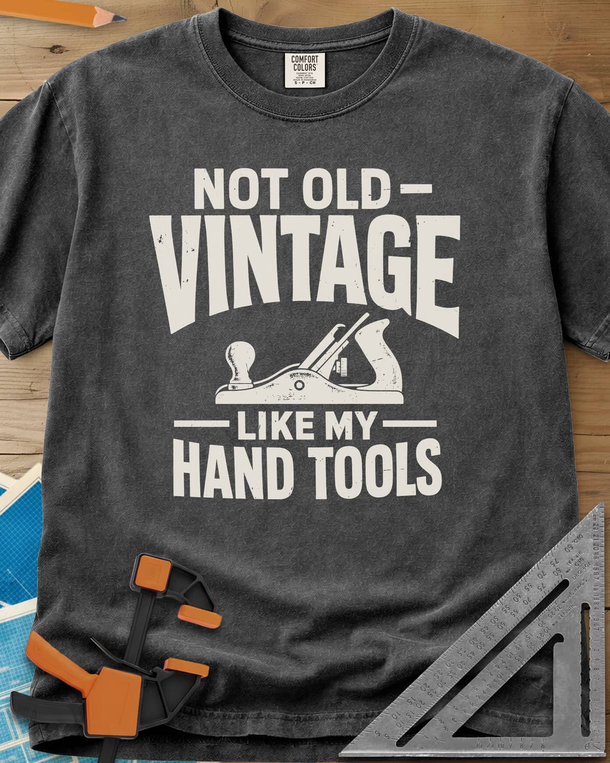 Vintage Tools heavyweight tee in Pepper, a small bench plane between worn block lettering
