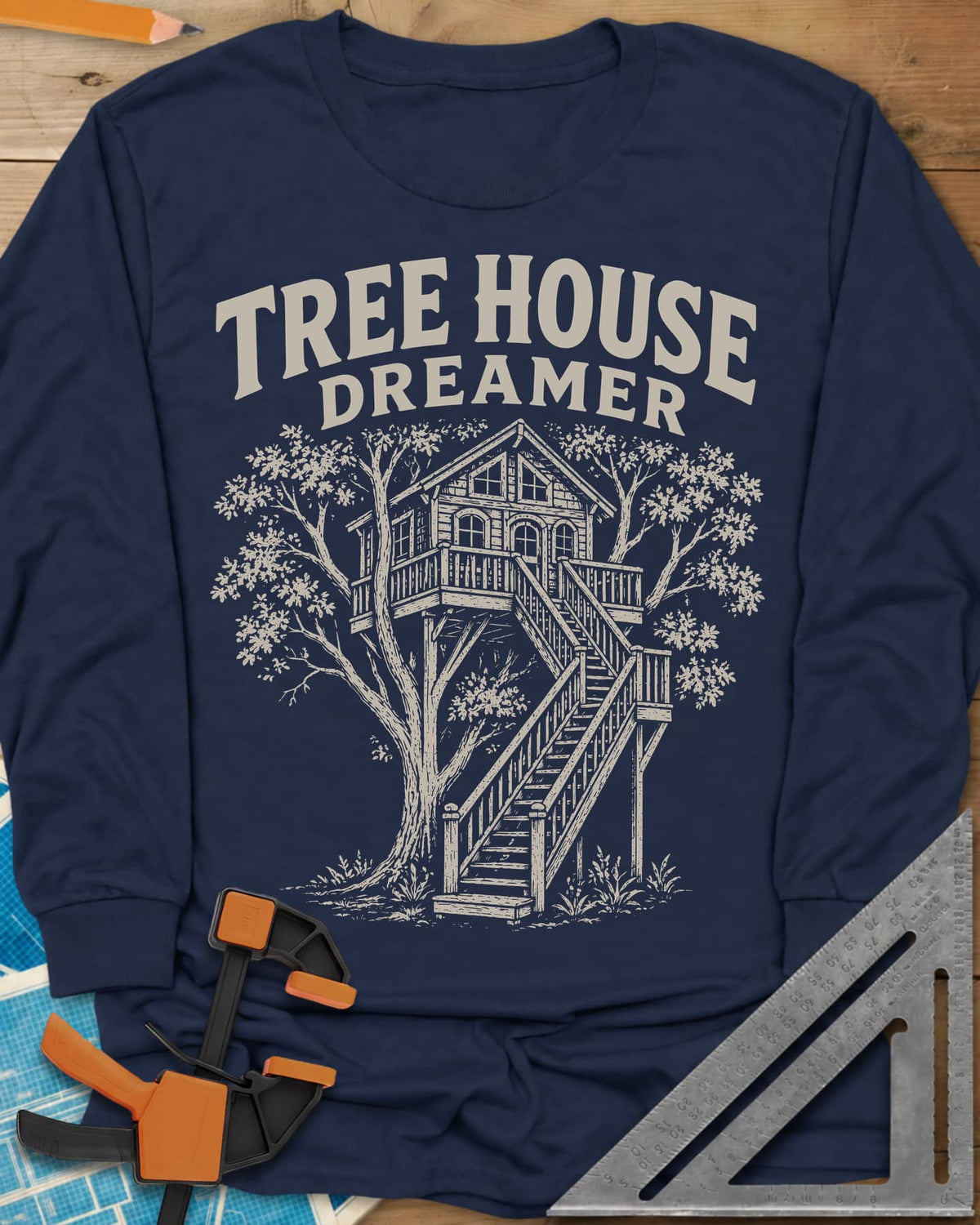 Vintage Tree House Dreamer long sleeve shirt in Navy, engraved-style treehouse with a railed deck and wide stairs