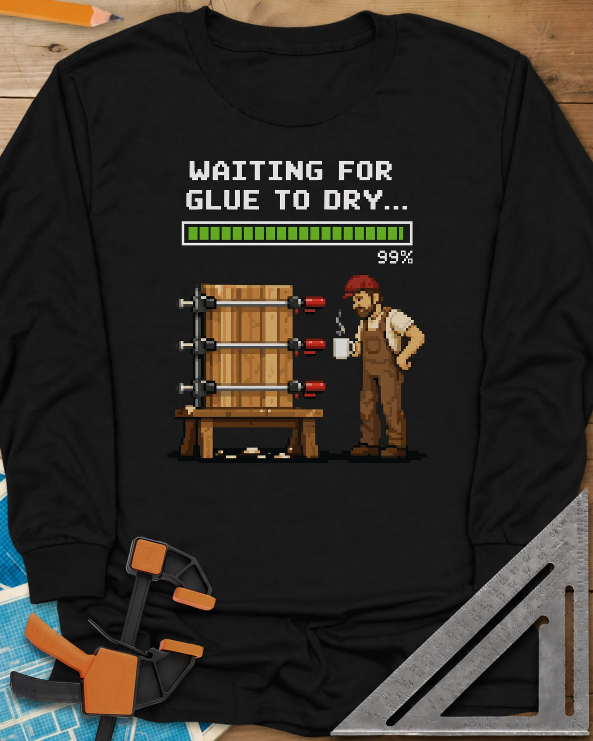 Waiting For Glue To Dry long sleeve shirt in Black, pixel-art woodworker with a coffee mug beside a clamped glue-up