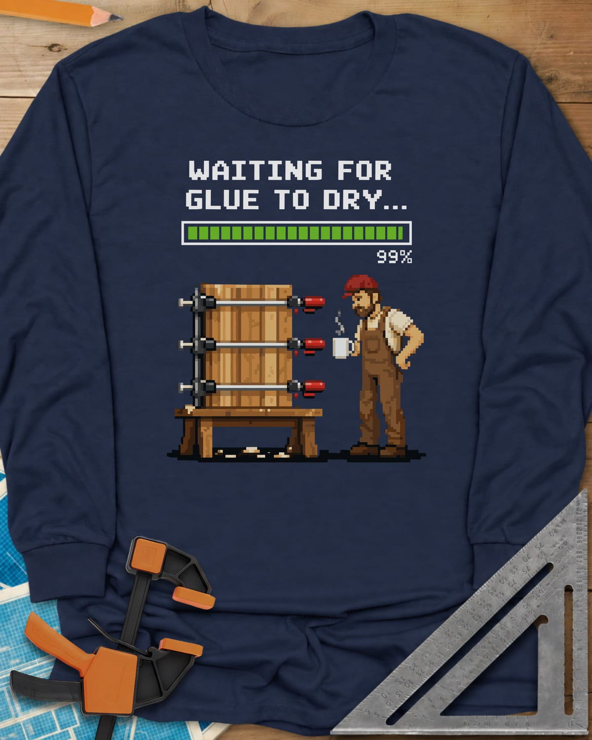 Waiting For Glue To Dry long sleeve shirt in Navy, pixel-art woodworker with a coffee mug beside a clamped glue-up