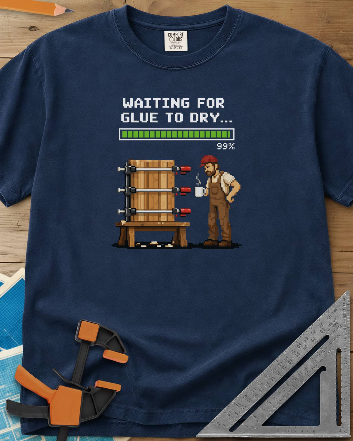 Waiting For Glue To Dry heavyweight tee in Navy, pixel-art woodworker with a coffee mug beside a clamped glue-up