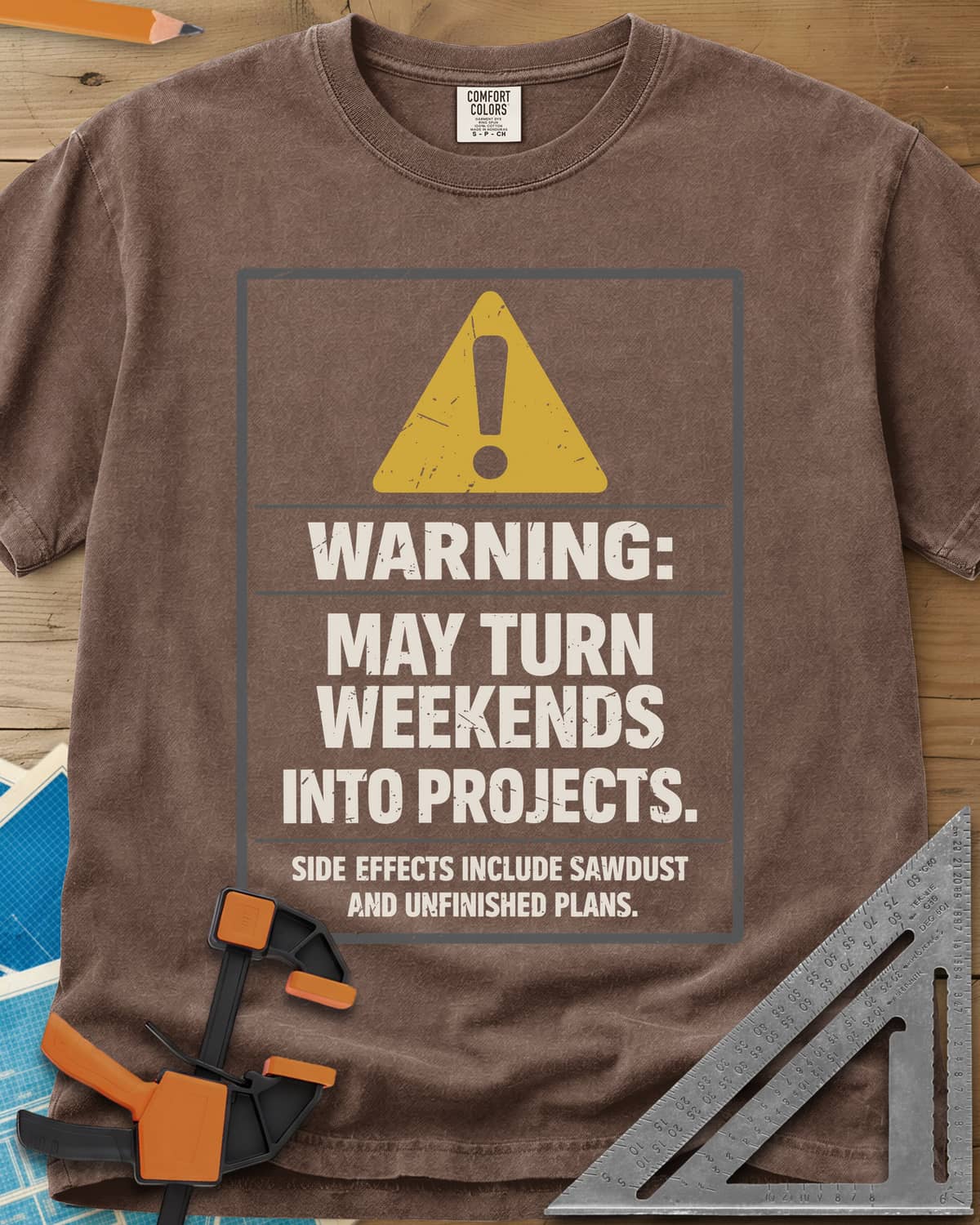 Warning Weekends Into Projects heavyweight tee in Espresso, a hazard-sign panel with a yellow triangle and a side-effects