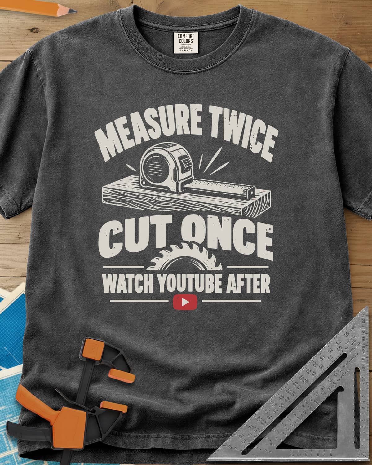 Watch YouTube After heavyweight tee in Pepper, tape measure on a plank, a saw blade and a red play button